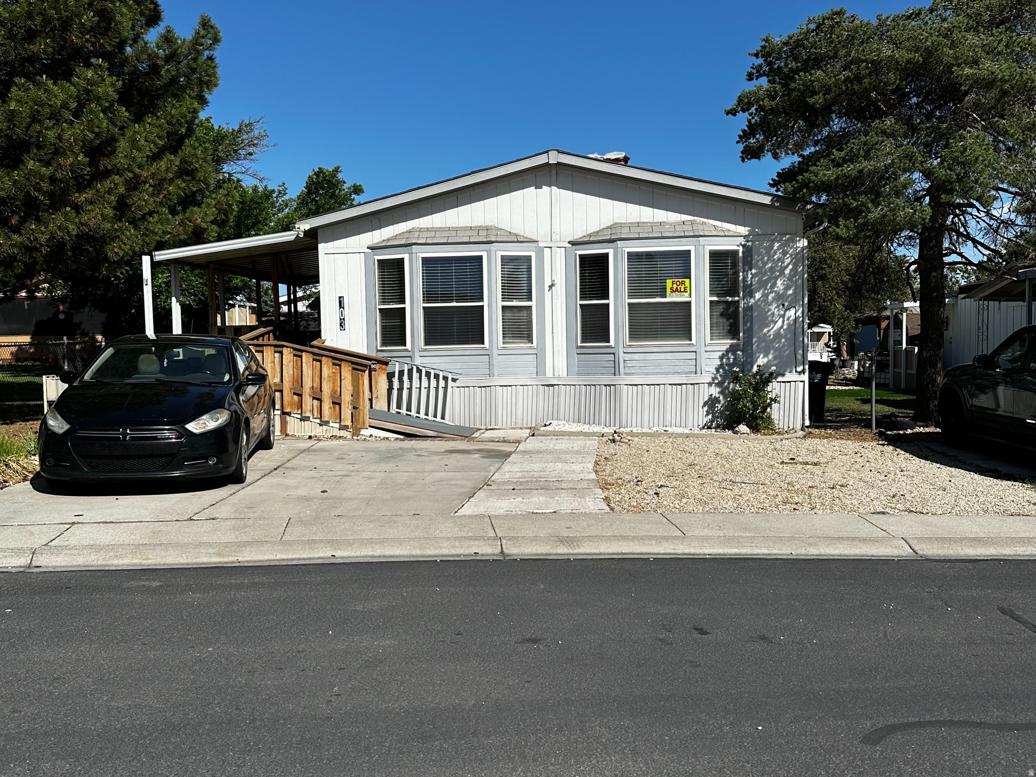 Beautiful Open & spacious double-wide mobile home in a desirable Kearns park. It features an open floor plan with Cathedral Ceilings. 3 bedrooms and 2 bathrooms, including a large master bedroom, 2 rooms up front, and the Master in the back. New flooring through-out, while the kitchen offers plenty of space and cabinets. At just over 1,500 square feet of pure coziness, this home feels homey, yet spacious. Enjoy the front porch with no neighbors in front of you, perfect for relaxing among the trees and birds. The backyard includes 2 - storage sheds and covered porches in both the front and back. This home has a great open spacious layout - You do not want to miss seeing this home.  **Please remember, You must get Approved with the Park before submitting an offer** Square footage figures are provided as a courtesy estimate only and were obtained from County Records. Buyer is advised to obtain an independent measurement.