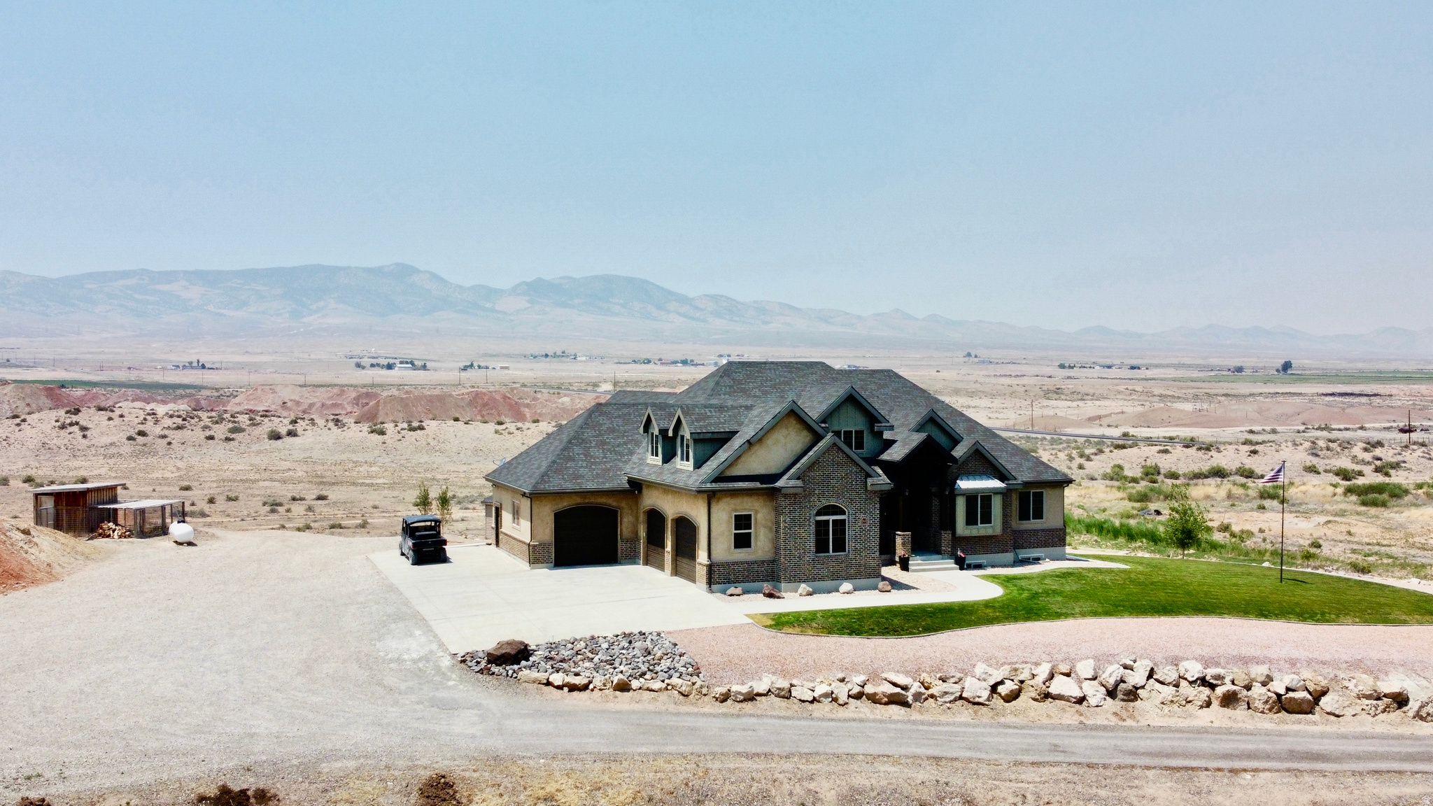 This beautiful home sits on 8.16 Acres, private drive, and views in every direction. This home was also recently connected to culinary water provided by Redmond Town. The finishes in this home are amazing, from granite, to stone work, and stain grade wood finishes. The basement has a lot of entertainment to offer with a game room, smaller kitchen-et, and a large theatre room with built in projector. The theatre room is well insulated for sound and is located under the garage area of the home. The heat and A/c for this home is controlled by Geo Thermal and heat pumps. Each floor is controlled by its own thermostat. The lower pastures have water taps and power already established. Plenty of room for an arena or large outbuildings for what ever your needs are. Buyers and agents to verify all listing information.
