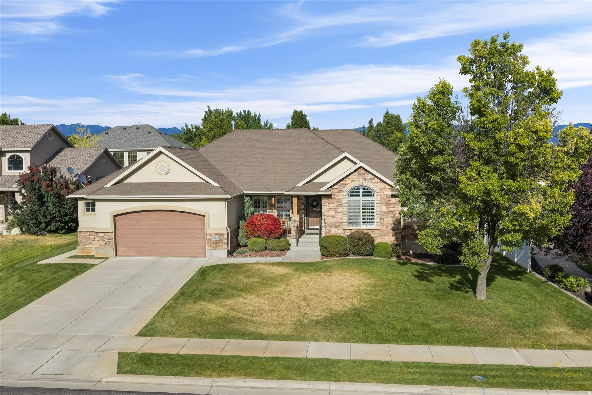 This is more than square footage...it's where quiet mornings begin with watching the sunrise on the covered patio, summer evenings are spent picking fresh fruit from your own trees, and every season becomes a backdrop for life's most meaningful moments. Nestled in one of West Point's established neighborhoods, this beautifully cared-for home offers 4 bedrooms and 3.5 bathrooms designed for both gathering and unwinding. The spacious kitchen naturally becomes the heart of the home-where meals are shared, celebrations are hosted, and memories are made. Two inviting gas fireplaces create warm, cozy spaces to relax with family and friends, while plantation shutters add timeless character throughout. The primary suite is a peaceful retreat featuring a generous walk-in closet and a spa-inspired bathroom with a separate soaking tub and shower-the perfect place to recharge after a busy day. The walk-out basement offers flexibility for entertaining, hobbies, a home gym, or simply extra room to grow. Thoughtful storage throughout the home, spacious walk-in closets, and an epoxy-finished garage floor make everyday living effortless. Step outside and you'll discover one of the home's most treasured spaces: a beautiful east-facing covered patio where cool mornings, shaded afternoons, and peaceful evenings invite you to slow down and enjoy the simple things. Mature fruit trees and a private backyard create a setting that's as relaxing as it is inviting. Living in West Point means becoming part of a community where neighbors know one another, children ride bikes through the neighborhood, and evening walks along nearby trails become part of your daily routine. Enjoy quick access to walking and biking trails, shopping, dining, and the West Davis Corridor, giving you the perfect balance of small-town charm and modern convenience throughout Davis County. This isn't just a place to live-it's a place to put down roots, build traditions, and truly feel at home.