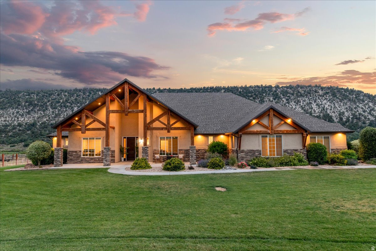 This stunning 40-acre estate offers a rare blend of luxury and peaceful country living, with the Sanpitch River gracefully running through the property. Designed with both comfort and entertaining in mind, the home features a spacious open-concept layout that seamlessly connects the great room, kitchen, and dining area to an expansive deck-complete with a TV, sound system, and hot tub wiring-creating an effortless indoor/outdoor living experience. The grounds are thoughtfully set up, featuring a 2-stall horse barn with tack room, fenced pastures, automatic livestock drinkers, irrigated raised garden beds, a storage shed, and full RV hookups. A private sport court for basketball and pickleball, a home gym (equipment negotiable), and a dedicated theater room complete with projector, surround sound, and large screen-all included. Surrounded by panoramic mountain views, frequent wildlife, and dark skies perfect for stargazing, the setting is as impressive as the home itself. The property also includes a 1 acre-foot water right. With convenient access to Skyline Drive, this property serves as an ideal gateway to ATV riding, hunting, fishing, camping, and year-round outdoor adventure. Additional highlights include a spacious primary suite, an oversized 3-car garage with extra depth, overhead storage, and a negotiable EV charger. The home is further equipped with a Generac generator, water softener, two new water heaters, and a large mudroom with custom built-ins. Fresh paint and new flooring throughout enhance the home's clean, move-in-ready presentation. Whether you envision a private retreat, a space to connect with loved ones, or a base for year-round adventure, this property delivers. Schedule your showing and discover the lifestyle it makes possible.