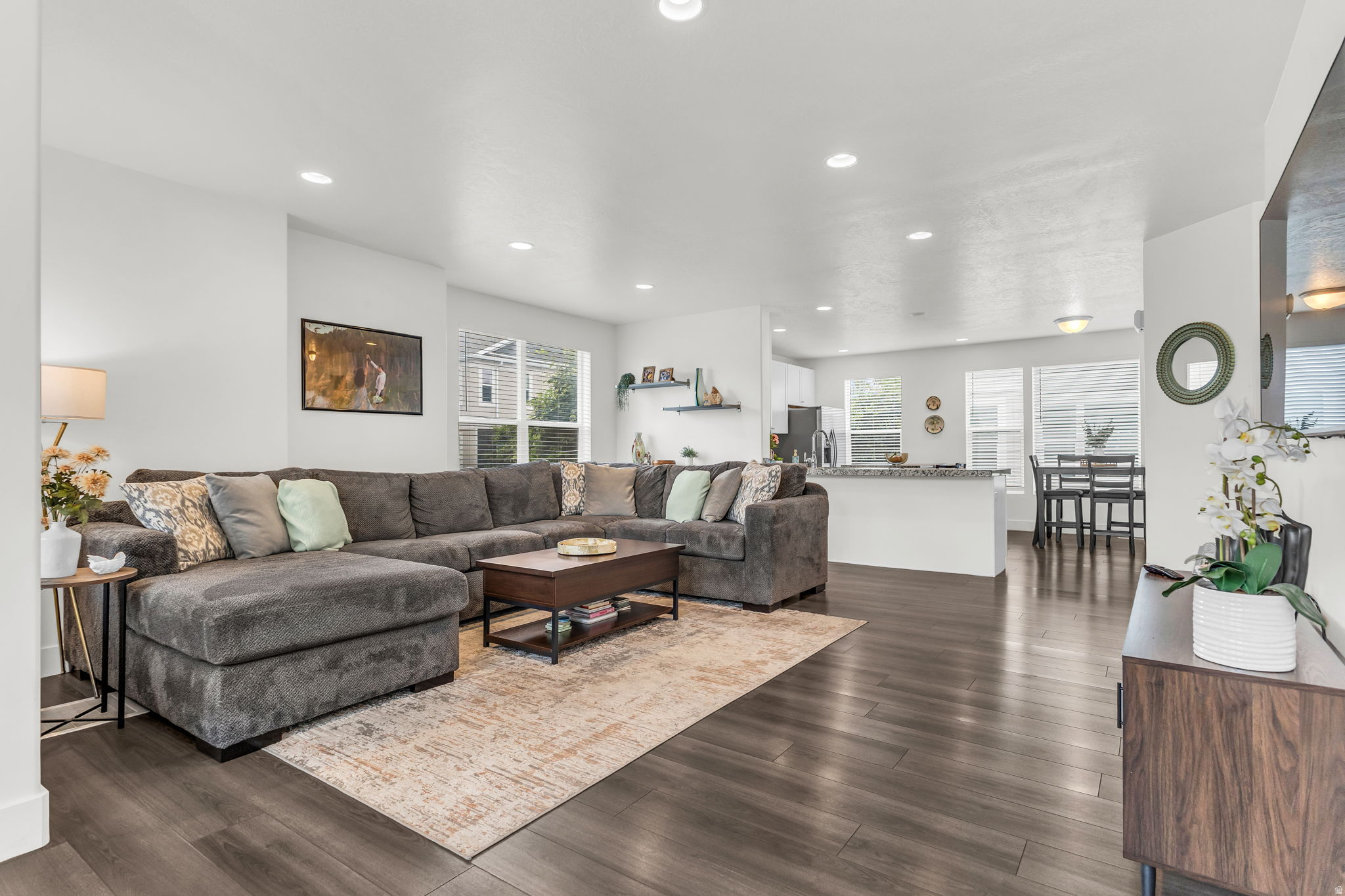 Modern move in ready townhome ideally located in the heart of Murray, very close to parks, gyms, grocery, coffee shops and restaurants. Step inside to find a large foyer with sliding glass doors that lead to a peaceful patio. Large open living room is adorned with views of the mountains and an inviting balcony, the open kitchen, dining space is flooded with light, well appointed island and huge pantry. Stunning views of Mt. Olympus as you wake up every morning in this oversized bright primary bedroom retreat w/ walk-in closet, large double vanity and shower.  Updates include new refrigerator, serviced a/c unit, smart thermostat and smart garage door MyQ app.  Square footage figures are provided as a courtesy estimate only and were obtained from county records.  Buyer is advised to obtain an independent measurement and confirm all details.