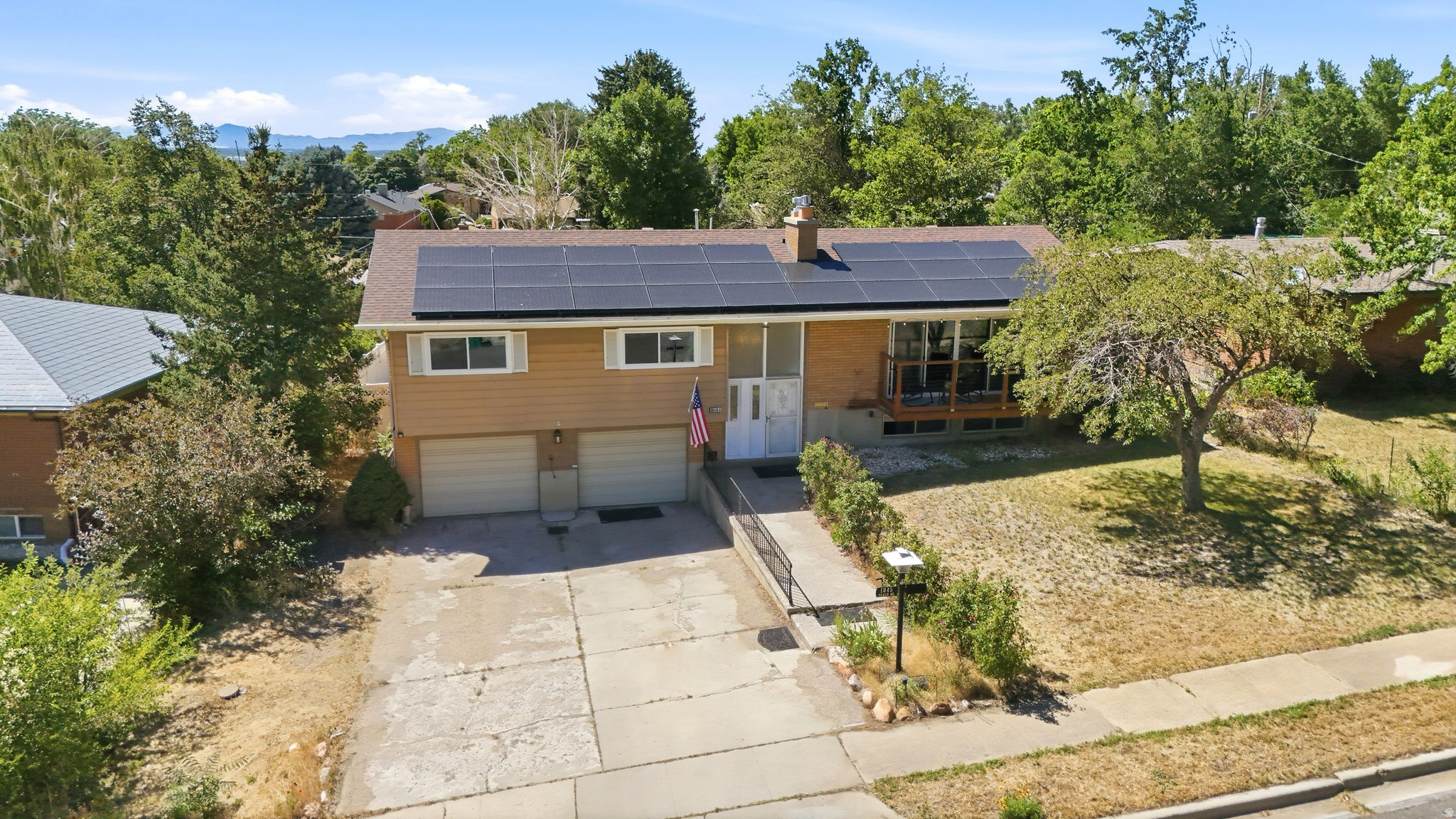 Enjoy the mountain views and an unbeatable location and short drive to Pineview Reservoir, hiking trails, and year-round outdoor recreation.   Recent improvements include solar panels (2025), new windows (2025), a new furnace, air conditioner, and water heater (2026), a newer roof (2021-previous owners installed). The home also features a charming sunroom, providing the perfect place to relax and take in the surrounding scenery.