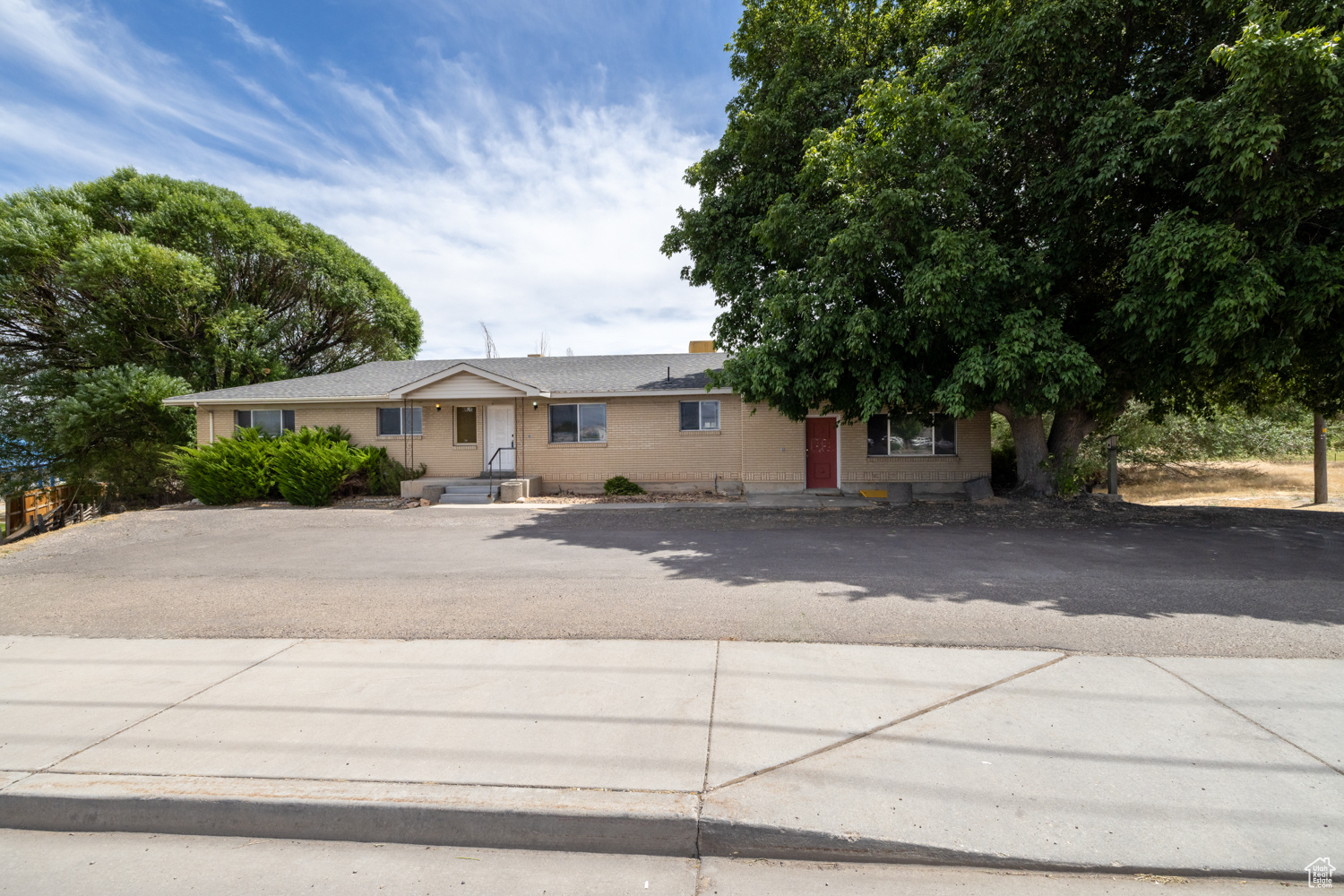 Prime Commercial Location on HWY 40! Take advantage of this high-visibility, high-traffic location next to Velocity Car Wash in Vernal, UT. This versatile office building offers over 4,400 sqft on the main level and basement, with the potential to divide into up to 5 separate suites-perfect for multiple tenants or a growing business. Built in 1976, the property includes a 724 sqft detached garage, shed and sits on a .76-acre lot, providing ample parking and accessibility. Included is a 12.5% interest in a water share (seller has knowledge but does not warrant its function). A rare opportunity to own or invest in one of Vernal's most visible commercial corridors! Additional 1/2 acre available for $75k (MLS#2103915) must have this property sold first or buy together.