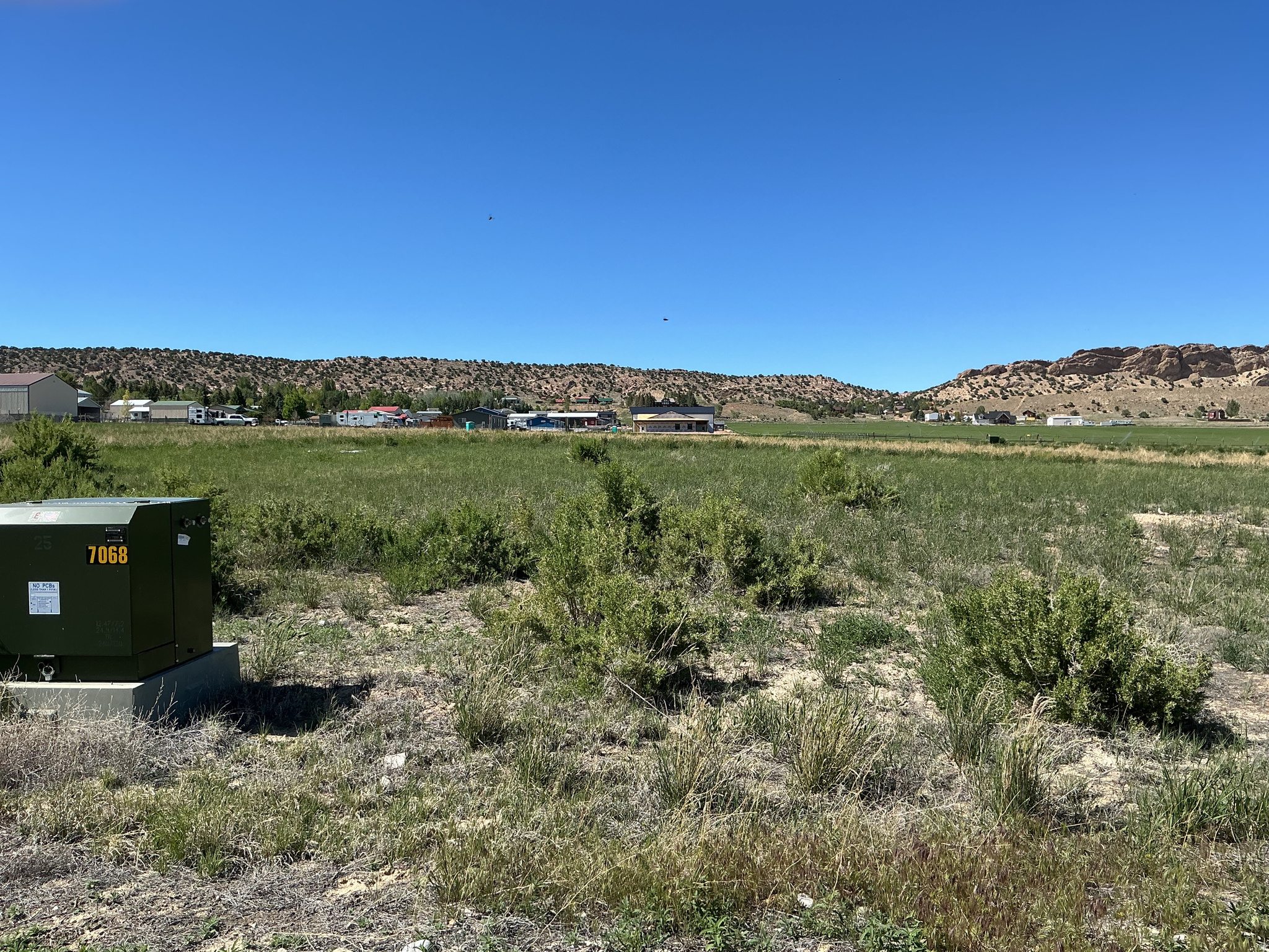 Just short of 1/2 acre.  Good building lot flag lot into 6th East subdivision.