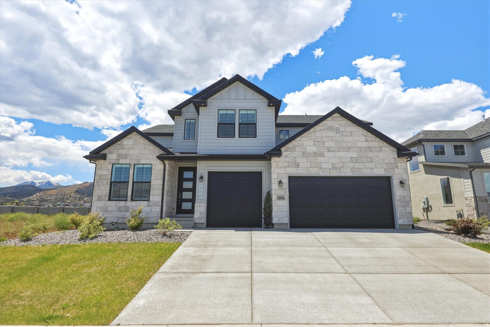 Beautiful newer construction tucked into a quiet Herriman cul-de-sac offering the feeling of country living while still being close to city conveniences. Oversized windows showcase breathtaking mountain views throughout. With 6 bedrooms, 5 bathrooms, dedicated office, attached ADU with separate entrance, spacious yard, and nearly 3,700 sq ft, this home offers a rare combination of size, flexibility, and newer construction that is hard to find in the area. Modern finishes and timeless touches make this home ideal for multigenerational living and everyday luxury. Select furnishings negotiable.