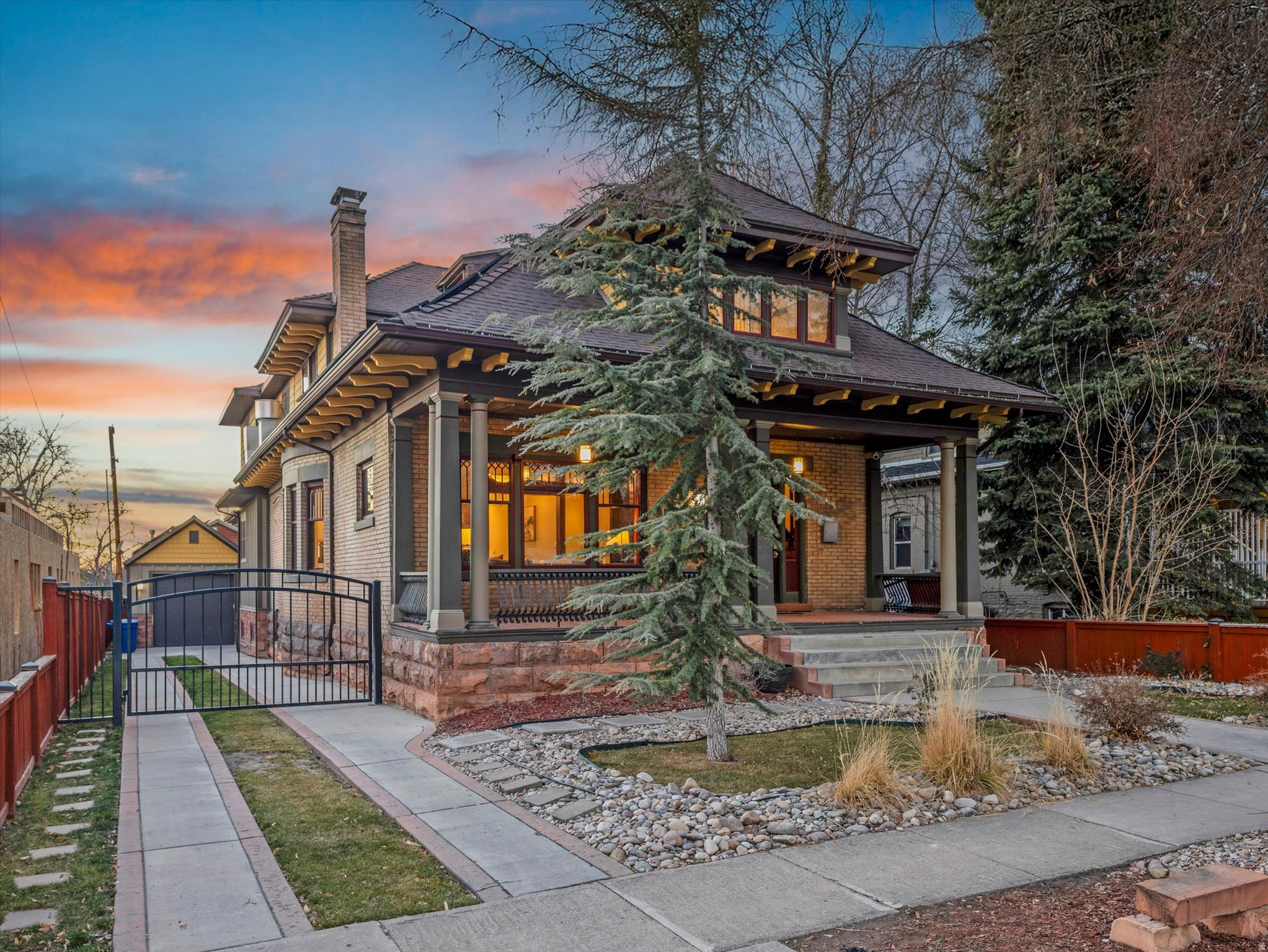 A masterful blend of timeless elegance and modern refinement, this extraordinary home will leave a lasting impression. Exceptional craftsmanship is showcased throughout, from the rich original woodwork and sweeping grand staircase to the striking antique fireplace and expansive windows that flood the home with natural light. The thoughtfully designed layout offers a seamless balance of refined daily living and elegant entertaining. Classic architectural details elevate every space, including beveled glass windows, graceful French doors, bespoke light fixtures, and multiple fireplaces that add warmth and character. The heart of the home is a chef-caliber, restaurateur-designed kitchen, appointed with an industrial-grade range and dual islands that provide unparalleled space for preparation and hosting. The formal dining area pairs beautifully with a charming breakfast nook, creating the perfect setting for intimate gatherings or grand celebrations alike. The meticulously restored upper level features a versatile office or playroom, generously sized bedrooms and bath, and an exquisite primary suite offering a true private retreat. Here, you'll find a spa-inspired bathroom, walk-in closet, private fireplace, and a secluded deck designed for quiet moments of relaxation. The lower level enhances the home's versatility with a newly added second kitchen, a laundry room, spacious bedroom, flexible living space suitable for a secondary bedroom, and a private entrance-ideal for hosting guests or accommodating multi-generational living. Outdoors, the serene backyard provides space to unwind or entertain, complemented by a rare 2.5-car garage and valuable water shares. Perfectly positioned near Liberty Heights, 9th & 9th, 15th & 15th, Emigration Canyon, and Sugar House, this exceptional home places you just minutes from premier dining, boutique shopping, vibrant nightlife, and beloved neighborhood cafs-offering luxury living in one of the city's most coveted locations.