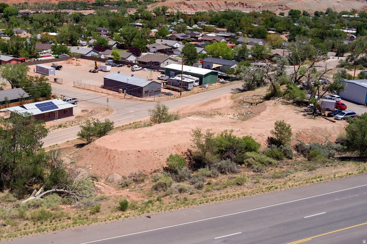 This parcel has everything you are looking for. Close approximate to town, or New College. Blt. want works for HC/SLR zone. So many possibilities. on .52 Triangle lot. That has views of the Red Rocks and the La Sal Mts. Owner Financing with qualified Buyer. Easy access off 2  sites.