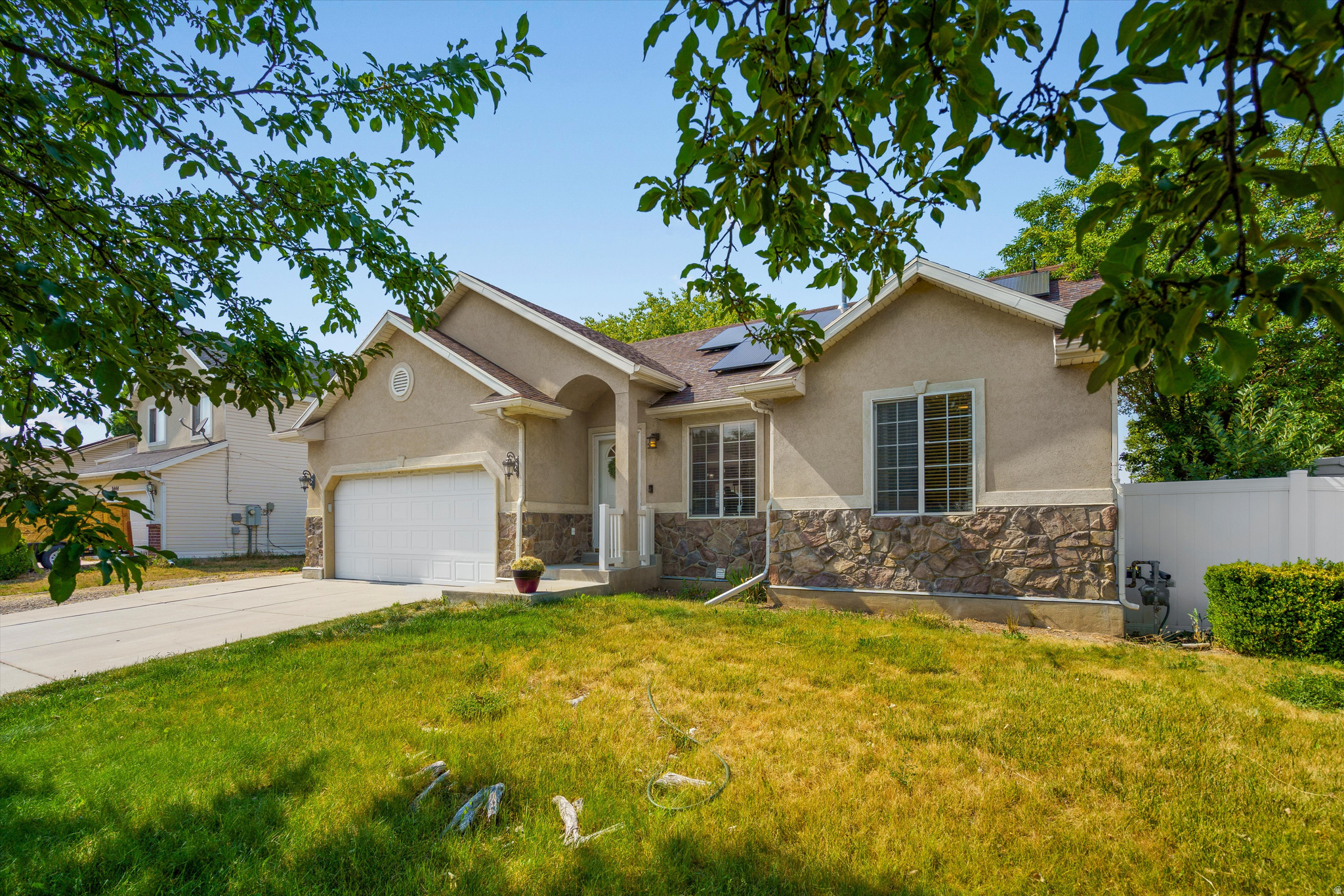 Utah summers can be brutal on the power bill, but this home helps solve that problem with fully paid-off solar panels-and that is just the start. This well-located Taylorsville home offers comfort, convenience, and valuable upgrades throughout. The open-concept living room and kitchen create a bright, functional space for everyday living and entertaining. New carpet has been installed in most of the home, adding a fresh and updated feel. Outside, the spacious yard provides plenty of room to enjoy, along with an RV pad for extra parking, toys, or storage. You will love the permanent exterior lighting - no more stringing Christmas lights every year. Conveniently located near multiple freeway access points, the airport, and shopping. There are three Costco locations all within approximately 15 minutes. A great opportunity in a central Taylorsville location! Square footage figures are provided as a courtesy estimate only. Buyer and Buyer's Agent are advised to obtain an independent measurement.