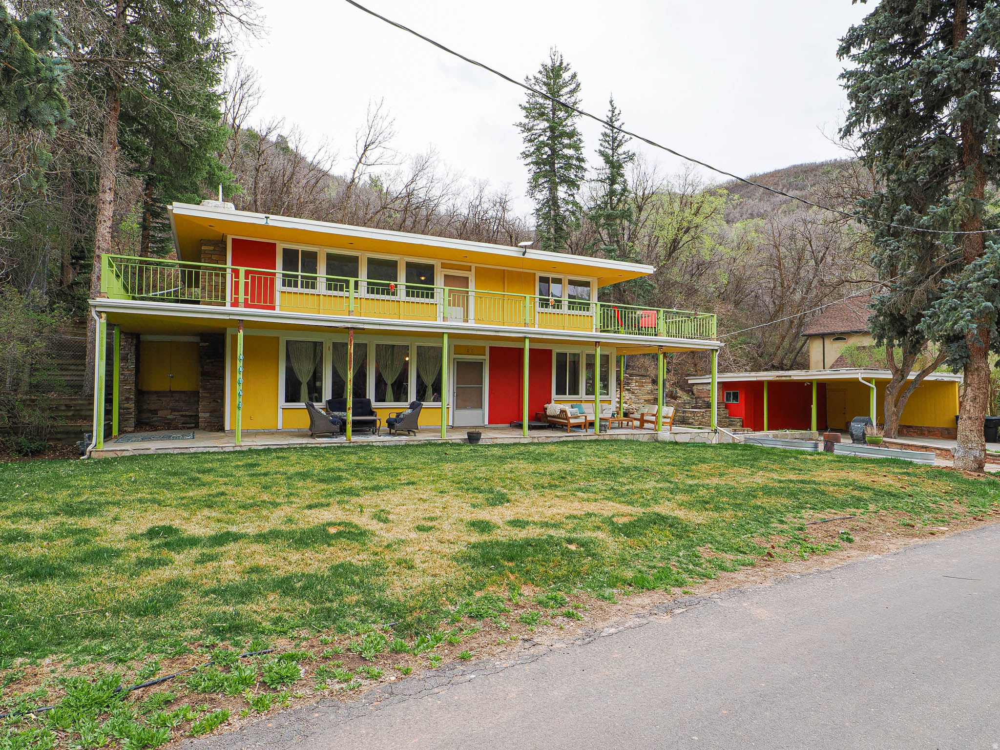 The best value in Emigration Canyon! Tucked into the serene beauty of Emigration Canyon, this distinctive mid-century modern home offers a rare blend of character, privacy, and potential. This 3-bedroom, 1-bath residence captures the timeless architectural charm of its era with clean lines, warm natural light, and a seamless connection to its surroundings. Inside, you'll find an inviting layout with comfortable living spaces and three well-proportioned bedrooms. The home is move-in ready while also offering room to grow, with existing plumbing in place for a second bathroom-an ideal opportunity to add value and functionality. Step outside and enjoy the peaceful canyon setting, where mature trees and natural landscapes create a tranquil retreat just minutes from the city. There is also a new wrap around deck.  A spacious 2-car carport with additional storage provides convenience and practicality. Whether you're drawn to its mid-century style, its expansion potential, or its unique location in one of Salt Lake City's most scenic areas, this home is a rare find with endless possibilities. **plumbed for second bathroom on main level.