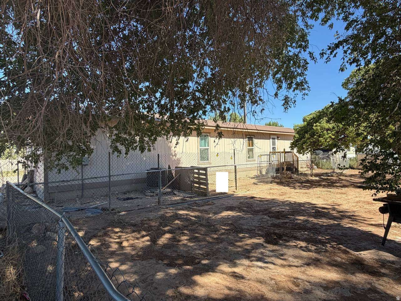 Discover this charming 2-bedroom, 1-bathroom residence spanning 840 square feet in Roosevelt. Built in 1995 on a spacious 0.3-acre lot, this property features central cooling, mountain views, a carport, and essential appliances. Benefit from an upcoming HVAC unit upgrade alongside equipped smoke and CO detectors. The interior showcases a wood slab floor in the front bedroom, accented by classic ceramic tile throughout. Perfect for anyone looking to personalize their space and customize details to their own taste.
