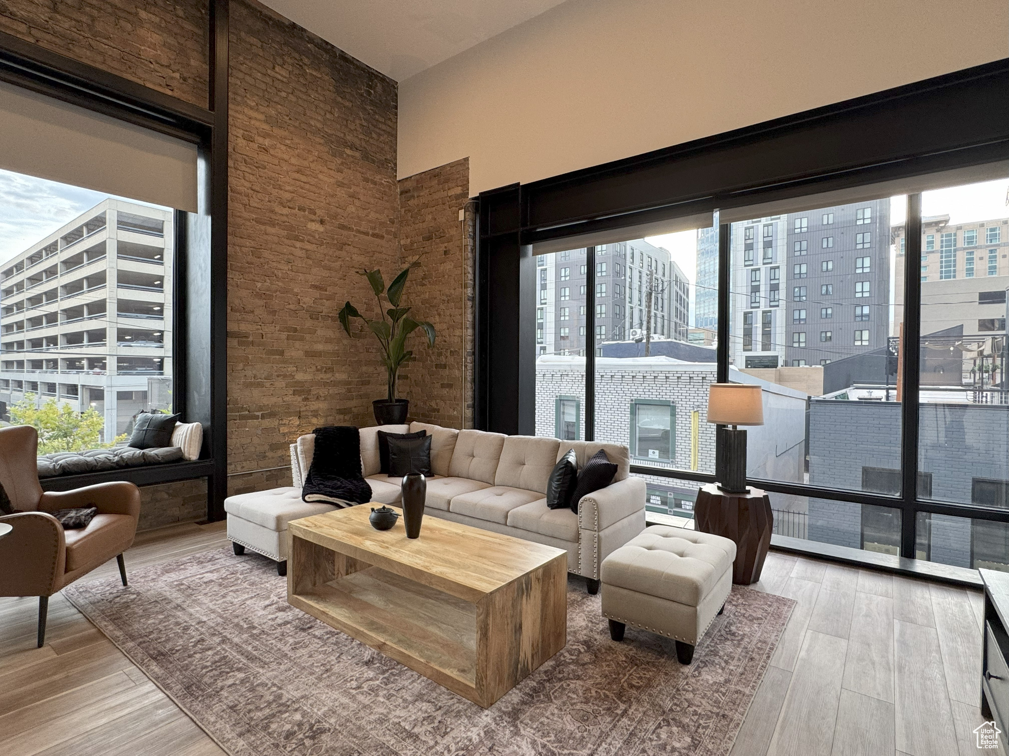 PRICE IMPROVEMENT! Welcome to your ownNew Yorkinspired urban sanctuary-a rare, architecturally stunning downtown condo with large roof top deck that captures the essence ofmodern city livingin the heart of Salt Lake. Recently renovated in 2024. This one-of-a-kind, luxury loft is unlike anything else in the city-boasting a bold, open layout that's both visually striking and functionally smart. Spanningthree dramatic levels, this industrial-chic space is packed with design-forward features:exposed brick, original wood beams, and soaring 22' ceilings(stretching up to 32' as the staircase winds through the levels). Massive9x9 city-facing windowsflood the space with natural light and serve up stunning views of the vibrant downtown streetscape below. The main floor is made for entertaining, with asleek kitchen, open-concept living/dining area, and a convenient guest bath. Upstairs, a mezzanine flex space makes the perfectsecond bedroom, home office, or creative studio, while the third level offers a spacious and privateprimary suite, full bath, and laundry. Top it all off with your very own400 sq ft rooftop deck-wired and ready for a hot tub, or simply a dreamy spot to unwind with friends, cocktails, and sunsets. Perfectly situated in a quiet alley between 200 and 300 South, you're steps from the best of Salt Lake's nightlife, food, theaters and more.  Plus you're minutes aways from shopping, a full-service grocery store, gym, convention center and everything else downtown has to offer.  Don't forget just a quick drive toworld-class ski resortsandendless outdoor recreation-from mountain trails to powder days, it's all within reach. Zoned D1, possibly allows for short-term rentals, this unit presents a compelling opportunity-whether you're seeking a high-end investment property or a personal downtown retreat. This isurban living redefined: bold design, unbeatable location, and unmatched downtown energy. Don't miss your shot to own this truly rare, luxury boutique loft in the heart of it all.