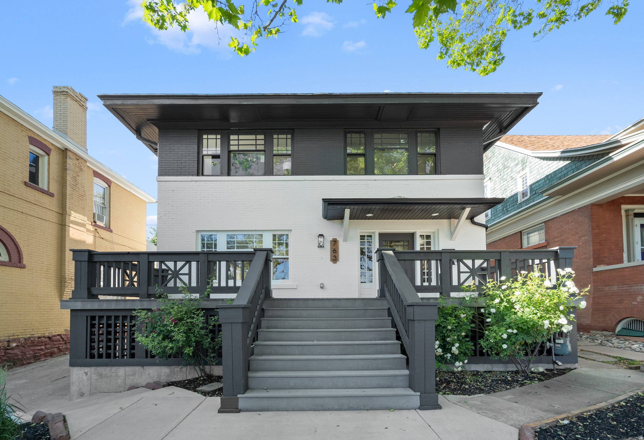 Extensively renovated and thoughtfully redesigned, this exceptional home blends historic character with modern comfort and functionality. Major improvements include a new HVAC system with all-new ductwork, complete interior plumbing replacement, full electrical rewire with updated panel, renovated kitchen, redesigned bathrooms, and fresh interior finishes throughout.  The spacious main level offers bright, open living spaces ideal for everyday living and entertaining, while the fully renovated kitchen serves as the heart of the home with quality cabinetry, updated finishes, and a functional layout.  A standout feature is the fully finished basement apartment, offering additional living flexibility for guests, multigenerational living, or potential rental income. The lower level was thoughtfully reconfigured to maximize space and usability.  Outside, enjoy the welcoming front deck, mature surroundings, and outstanding curb appeal. The property also features a newly constructed two-car garage, providing ample parking and storage.  With extensive interior renovations already completed, updated major systems, a basement apartment, front deck, and two-car garage, this move-in-ready property offers a rare combination of character, versatility, and modern upgrades.
