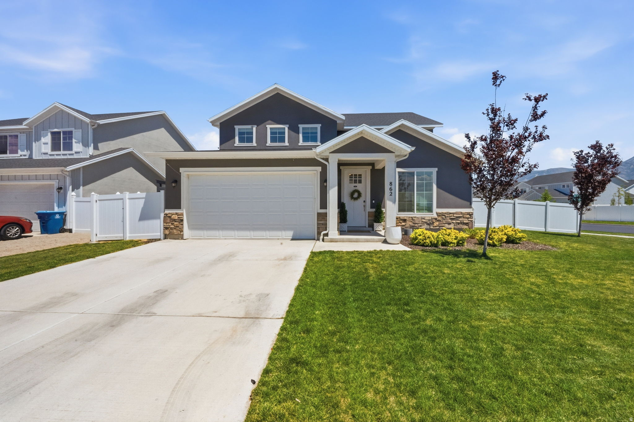 Imagine starting your mornings with a peaceful walk by Utah Lake, taking in the incredible mountain views, then hopping on the FrontRunner just 2 minutes from your front door for an easy commute anywhere along the Wasatch Front. Tucked away in a quiet American Fork neighborhood, this beautifully designed home offers the perfect blend of convenience and comfort. Inside, you'll love the open-concept layout filled with natural light, creating a bright and welcoming space for gathering and entertaining. The kitchen features a spacious butler's pantry for extra storage and prep space, while the main-floor guest bedroom and full bath provide flexibility for visitors, multigenerational living, or a home office. Step outside to a large concrete patio pad, perfect for summer BBQs, outdoor dining, or simply enjoying Utah's beautiful evenings. Built in 2023 with 4 bedrooms, 3 bathrooms, and nearly 2,900 square feet, this home offers modern living in an unbeatable location near Utah Lake, parks, shopping, dining, and transportation.