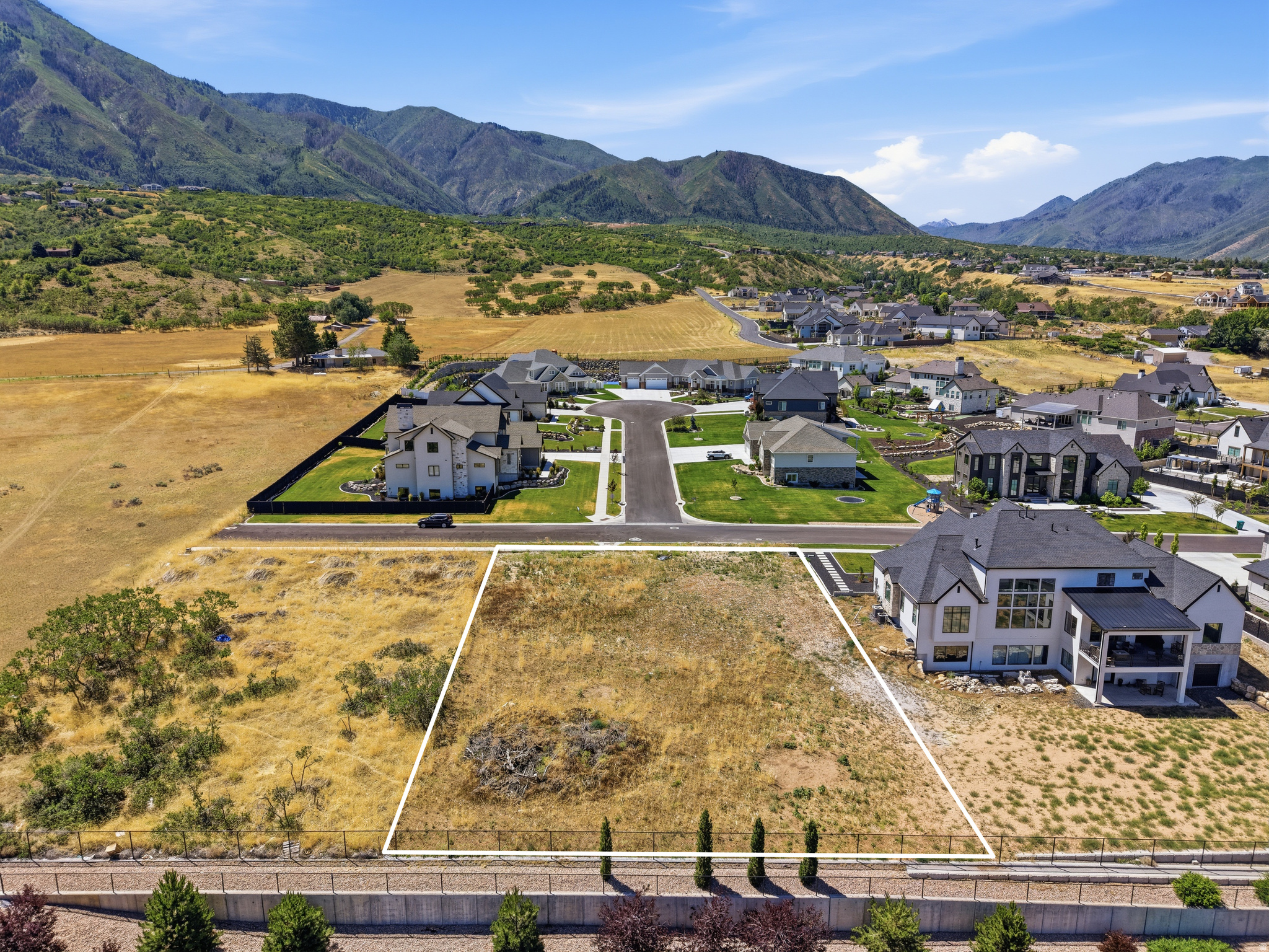 Don't miss this rare walkout lot with expansive valley and mountain views, and no HOA.  With .45 acres you have room to design and build your dream home in the stunning Four Seasons neighborhood. All utilities are stubbed out to the lot and it is ready to build.