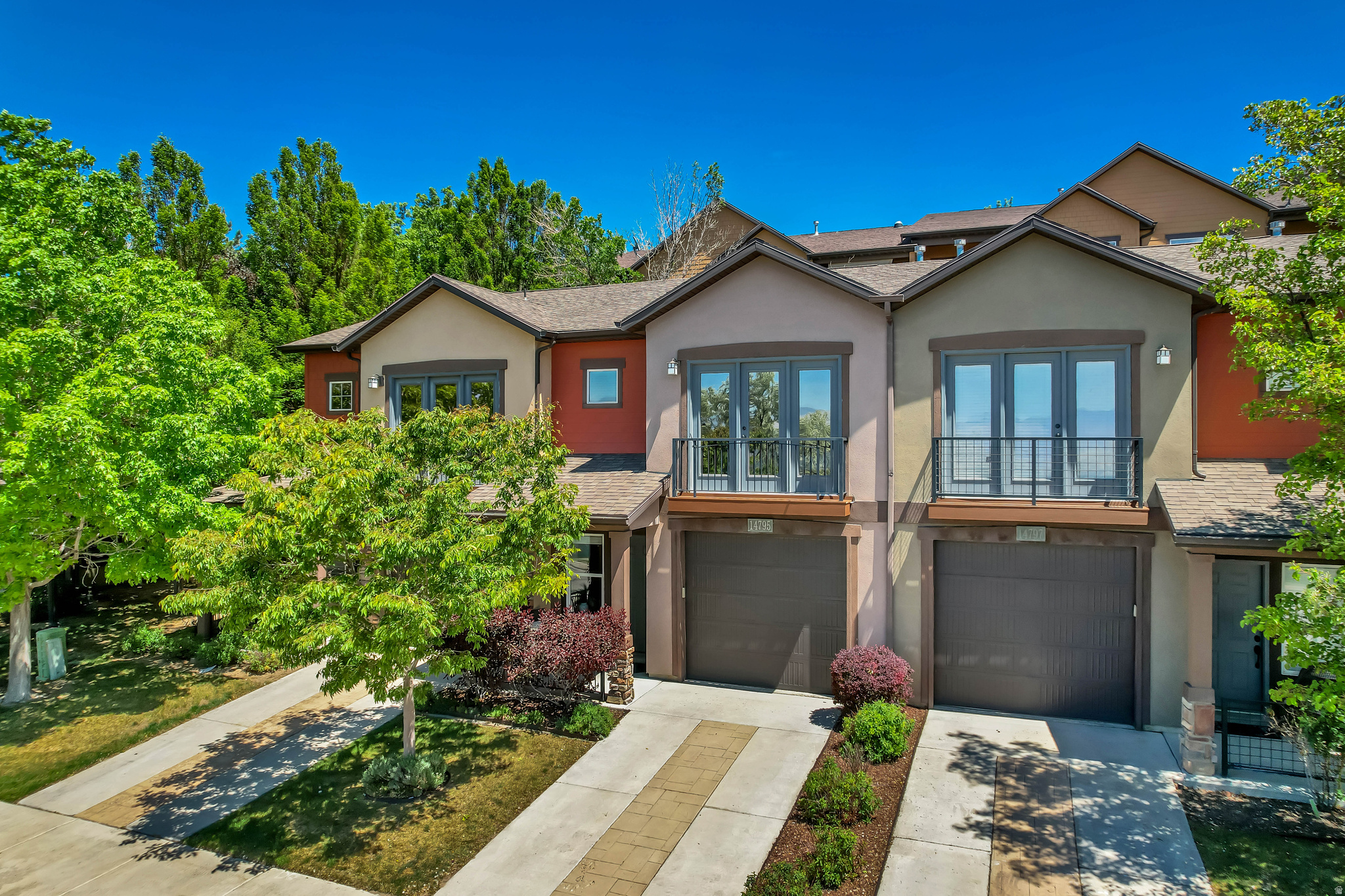 Don't forget to check out the full virtual tour also! Beautifully Updated Townhome in a Premier Neighborhood! Welcome to this stunning, move-in ready townhome nestled in one of the area's most sought-after communities. Thoughtfully updated from top to bottom, this residence seamlessly blends timeless elegance with modern comfort.  Step inside to discover rich wood type floors that flow throughout the main living areas, complemented by walls in a warm, neutral palette and classic crown molding that adds a sophisticated architectural touch. The updated kitchen impresses with gleaming granite countertops, newer appliances (2019), tile backsplash, offering both beauty and functionality for everyday living and entertaining alike. The HVAC system was fully replaced in 2025 and water heater in 2020.  The home features two generously sized bedrooms and two and a half bathrooms, providing an ideal layout for comfortable daily living. The primary bathroom was completely remodeled with a stand alone tub, european style glass shower, designer tile floors, quartz counters and accent wall.  The bedroom also features a 3 panel door/window that opens to a newly rebuilt Juliet balcony and stunning mountain views. A private one-car garage adds convenience and valuable storage. Whether you're relaxing in the light-filled living spaces or stepping outside to enjoy all that this premier community has to offer, this townhome delivers the lifestyle you've been looking for.  Hiking and biking trails are just outside your door all along South Mountain, Corner Canyon and Traverse Ridge. Don't miss your opportunity to own a truly turnkey home in an unbeatable location - schedule your private showing today.