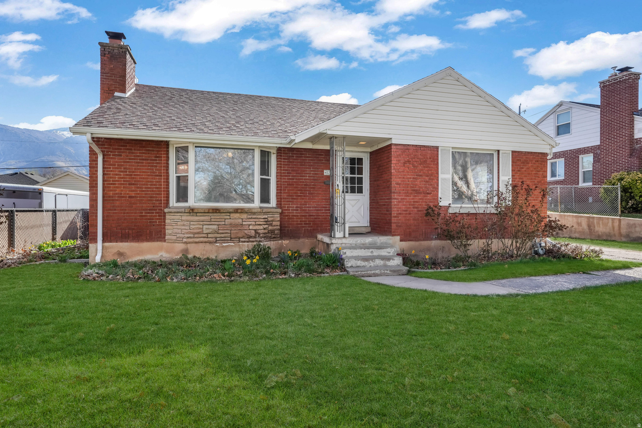 Darling all-brick rambler with garage!  5 bed, 2 bath. Nice open floor plan. Home has been updated but still has the old charm. Large fenced backyard with covered patio.