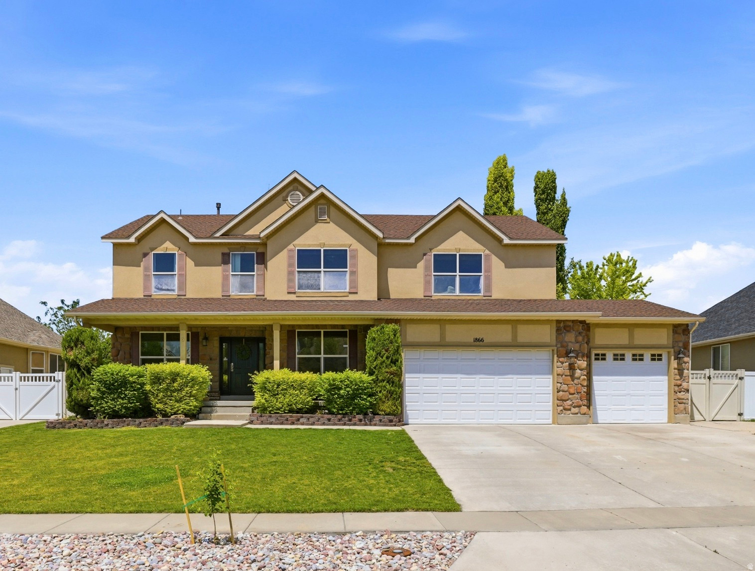Located in the desirable Pheasantbrook neighborhood of Kaysville. This home features a spacious floor plan with a stunning 2-story great room, large windows, and a cozy gas fireplace. You'll also find formal living and dining areas, plus an open kitchen with granite countertops, double ovens, and abundant cabinet space. The oversized primary suite includes vaulted ceilings, a double vanity, separate tub and shower, and a walk-in closet. The additional bedrooms are generously sized, and the finished basement provides plenty of room for entertaining or play space, with plumbing already in place for a second kitchen. Step outside to a backyard designed for gatherings, complete with a large covered patio, built-in outdoor kitchenette, gazebo, gas fire pit, chicken coop, and shed. Don't miss it!