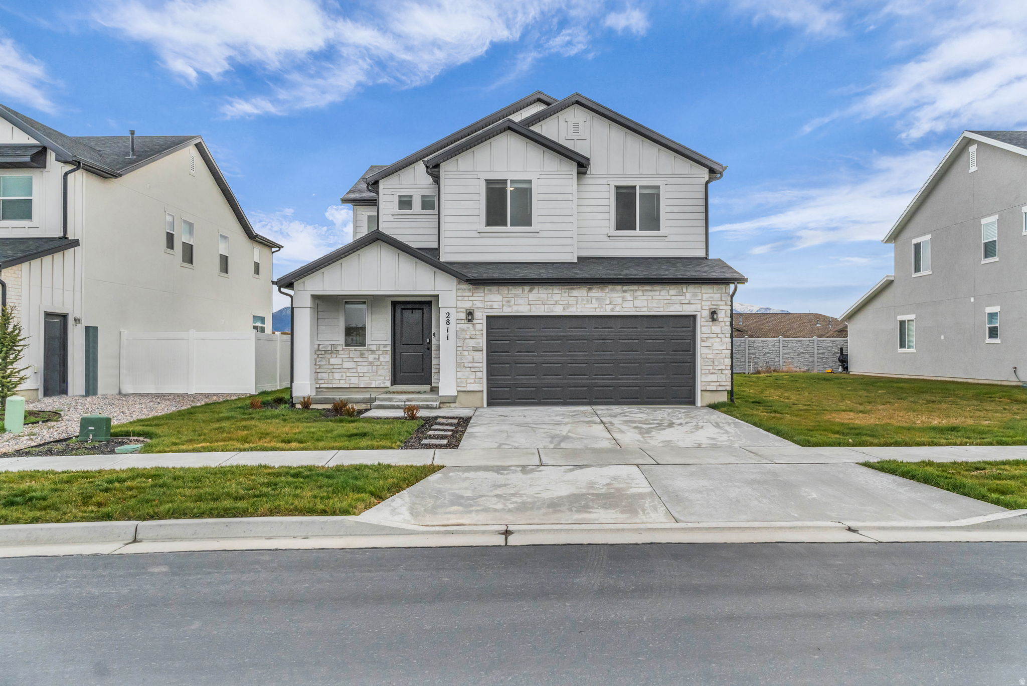 Step into this nearly new, beautifully designed 3-bed, 3-bath home in a fast-growing Syracuse neighborhood! Built in 2024, this light and bright home features an open-concept main floor with stylish black granite countertops, a tiled backsplash, and a spacious walk-in pantry. You'll love the cozy reading nook off the entry, sleek LVP stairs, and the inviting built-in fireplace.  Upstairs, find all three bedrooms, including a generous primary suite with a large walk-in closet and an extended dual-head shower. Outside, enjoy the fully landscaped yard with a covered cement patio, complete with a ceiling fan, perfect for summer evenings. Smart home features, a full sprinkler system, and a location near new schools, future retail (including Costco), and quick highway access make this home a perfect blend of comfort and convenience. Square footage figures are provided as a courtesy estimate only and were obtained from County records. Buyer is advised to obtain an independent measurement.
