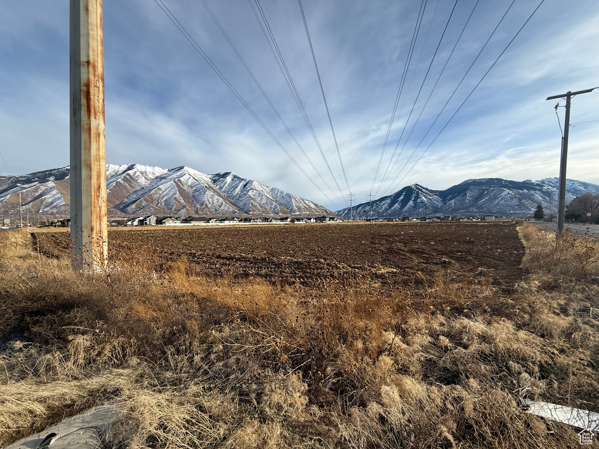 This fantastic corner lot offers a highly desirable location just steps away from Maple Mtn High School , making it an ideal spot for residential or commercial development. This property is perfect for investors, developers, or anyone looking to build in a thriving area.
