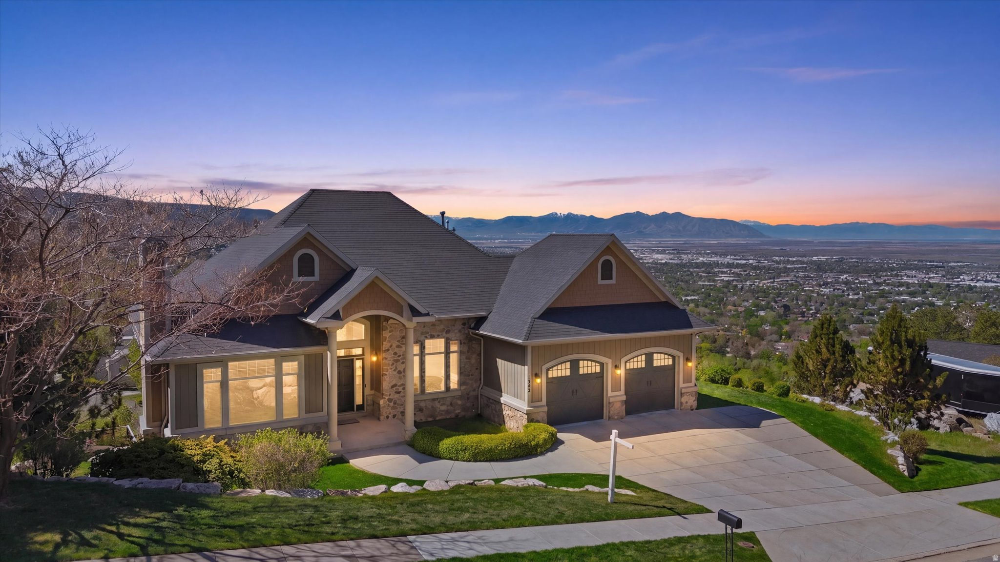 *PRICE REDUCED* This stunning 6,656 sq ft rambler is your summer view destination! This home captures breathtaking panoramic views of the lake, mountains, and valley from nearly every room and every level. Great for multi-generational living, the main level features a luxurious primary suite, spacious great room, and a chef's kitchen complete with a Thermador gas range, double ovens, and granite countertops. The lower level offers a full suite with its own kitchen, large bath, 4 bedrooms, private balcony, laundry, oversized storage rooms, central vac, and direct garage access, perfect for extended family, guests, or rental potential. The walkout basement has space for a gym, playroom, home business, theater, or ultimate entertaining zone. Step outside to multiple decks and patios designed for unforgettable summer nights, sunset dinners, and front-row seats to Utah's most spectacular views. Oversized garage with extra height, EV charger, and RV parking complete this exceptional property. Work-from-home retreat, income opportunity, or forever home, this one offers it all.