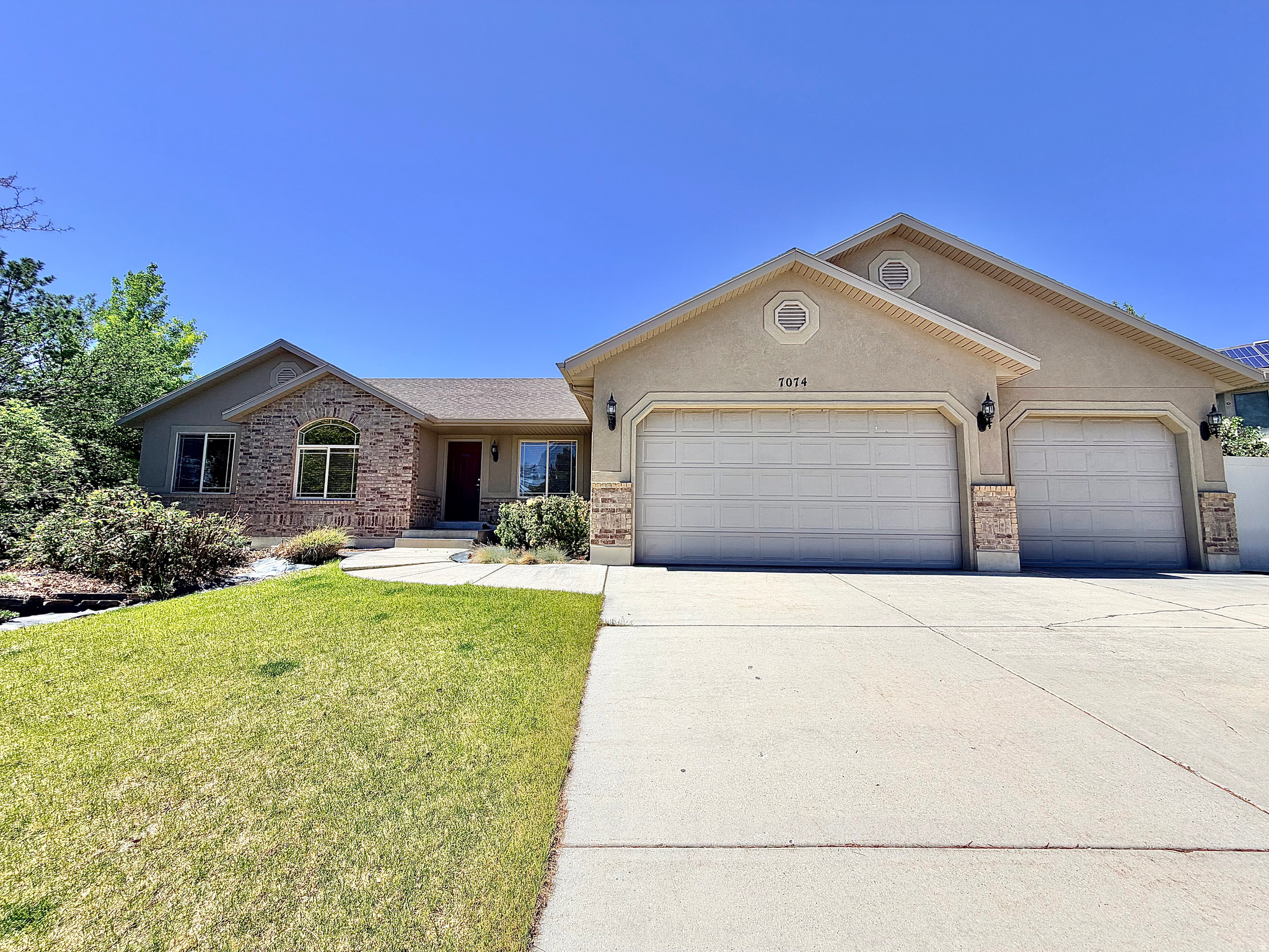 You get single level living in this spacious rambler with a 3 CAR GARAGE!  Great OPEN FLOOR PLAN, with VAULTED CEILINGS and FIREPLACE! The bright and roomy kitchen includes a large island and a newer range with air fryer.  French doors open from the dining area out to a deck and patio, which is the perfect flow for entertaining and grilling! The primary bedroom features a walk-in closet and an ensuite bath with separate tub and shower.  HVAC SYSTEM with air purifier replaced in 2022, water heater replaced in 2026.  Basement has 3 bedrooms, bathroom and is waiting for you to complete and put your own personal touch on the family room. POOL TABLE included.  Storage shed. Drip system and garden beds! Fantastic area, close to shopping and dining!  MOTIVATED SELLER!!