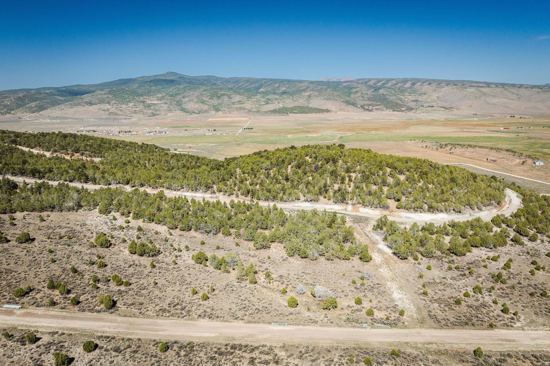 Build your mountain retreat in Blackhawk Mountain Estates. This beautiful 1.01-acre homesite in the Sundance Ridge phase offers stunning mountain views, privacy, and endless outdoor recreation just a short drive from Utah County.  Situated on a quiet dead-end road with a gentle slope, Lot 17 provides an ideal setting for a custom home, vacation getaway, or investment property. Short-term rentals are allowed, offering flexibility for personal enjoyment or income potential.  Experience four seasons of adventure with nearby ATV trails, hiking, horseback riding, fishing, hunting, snowmobiling, and more-all while enjoying the peace and beauty of mountain living. All information herein is deemed reliable but is not guaranteed. Buyer is responsible to verify all listing information, including square feet/acreage, to buyer's own satisfaction