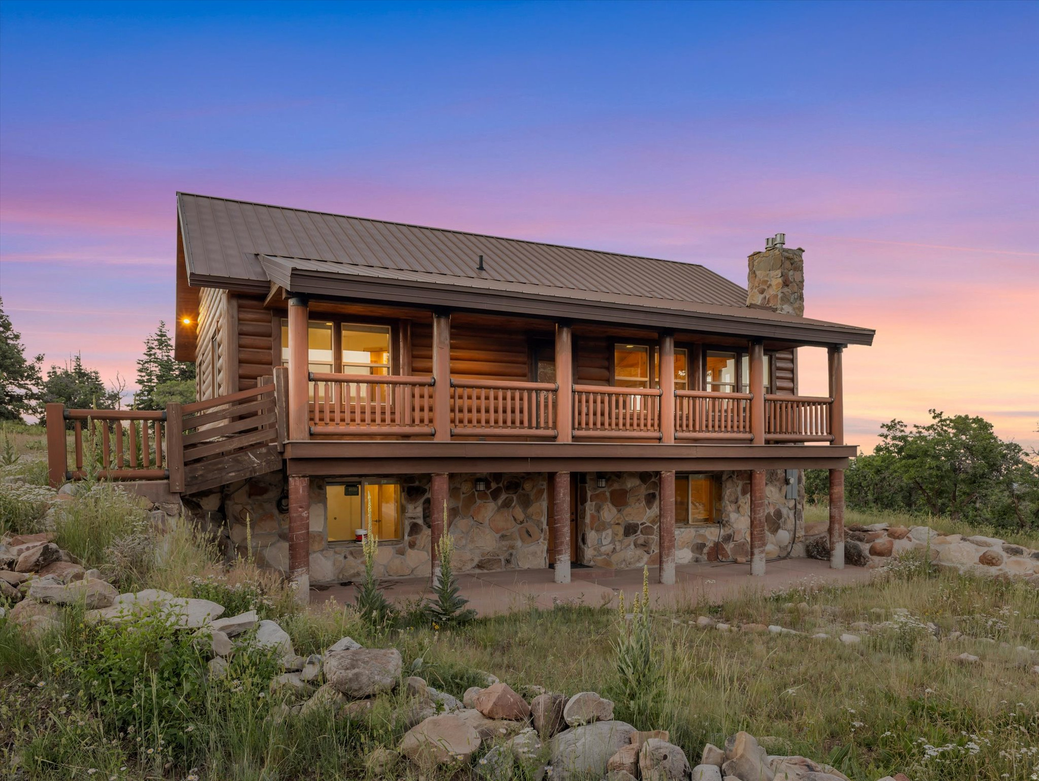 One of the most exceptional properties in Stagecoach Estates - a private, gated mountain sanctuary offering unmatched views, craftsmanship, and space just minutes from Kimball Junction and all that Park City has to offer. Set on over 10 acres in one of the premier locations within the community, this extraordinary log cabin captures the true essence of mountain living. The property showcases breathtaking panoramic views of the valley, surrounding ski resorts, and endless mountain ranges that seem to stretch forever. Every detail was thoughtfully designed to blend rustic elegance with timeless comfort. Inside, the warmth and character of the home immediately stand out with stunning tongue-and-groove ceilings, towering vaults, expansive windows, and beautiful natural finishes. Much of the custom rockwork was sourced directly from the property, creating a one-of-a-kind connection between the home and the land it rests upon. Enjoy two covered decks designed for year-round outdoor living - the perfect setting for taking in the peaceful beauty of the mountains. With an abundance of windows and a location directly on the plow route, this retreat offers both convenience and incredible year-round access. Designed for gathering, the home provides generous space for family and friends, while the expansive flat parking area makes hosting effortless. Whether you're seeking adventure, relaxation, or a true mountain escape, the recreational opportunities are endless. Located in the highly sought-after Park City School District, this remarkable Stagecoach Estates property offers the rare combination of privacy, luxury, convenience, and breathtaking natural beauty. A true mountain masterpiece - where every sunrise, every view, and every season feels extraordinary.