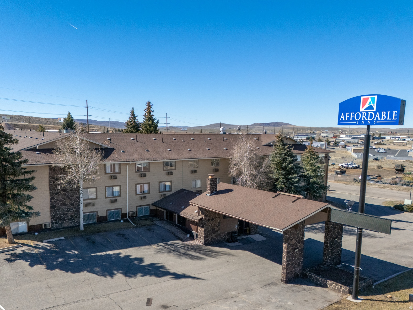 APEX Real Estate presents this ~140-key hotel directly off Exit 3 on I-80 in Evanston, Wyoming-right at the Utah border on one of the country's busiest east-west interstate corridors. Located in a designated Opportunity Zone for significant tax-advantaged investment potential. Currently vacant and ready for immediate repositioning, the property offers: Recently updated lobby, restaurant, and bar areas, proven hybrid nightly/extended-stay history, unfinished on-site manager's apartment for live-in management, Exceptional I-80 visibility and direct access, All FF&E included, and transferable resort liquor license for added beverage revenue. Priced at $1,750,000 (~$12,500 per key), it requires low additional CapEx to reopen and stabilize-ideal for franchising with a national/regional brand. Perfect for owner-operators, investor groups, or developers targeting limited-service, extended-stay, or branded interstate hotels with liquor license upside. Contact Cody Ferrin at APEX Real Estate for additional details or to schedule a tour. Property sold "as-is"; the buyer and buyer's agent must verify all information independently.