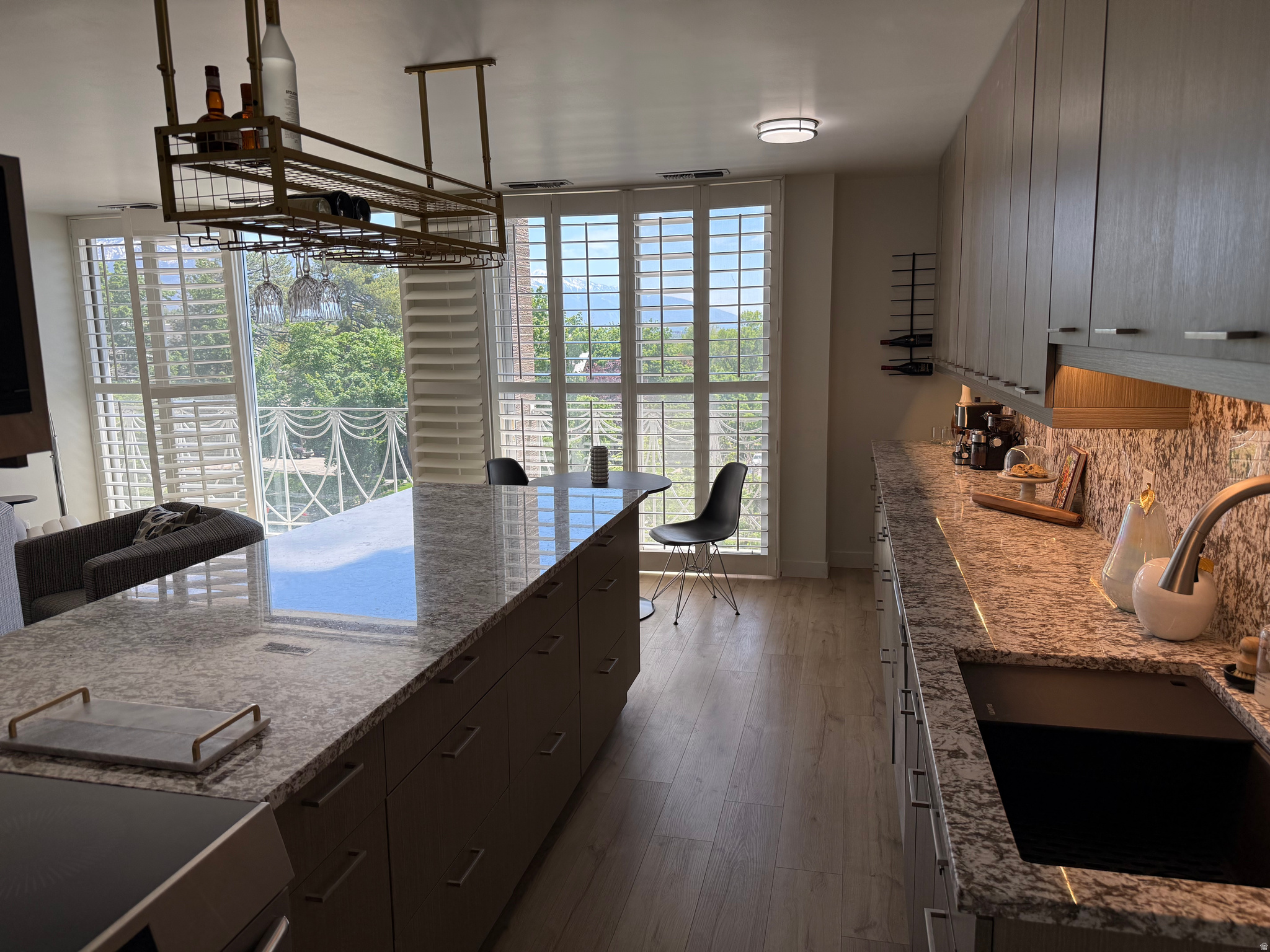 Stunning, fully renovated 2BD/2BA condo in the iconic Bonneville Tower with breathtaking south and west-facing views of Salt Lake City and the Wasatch mountains-plus a front-row seat to historic South Temple street! Valuable floor-to-ceiling windows. This turnkey unit has been completely transformed from top to bottom with brand-new appliances, floors, fixtures, and finishes throughout. The large, open-concept kitchen and dining area are perfect for entertaining, while the living space is bathed in natural light and framed by plantation shutters for style and privacy. Enjoy the comfort of generous living spaces, modern elegance, and city views from every window. This building offers a secure, quiet atmosphere with a pool, gazebo, and outdoor BBQ. It is located 1 mile from City Creek's downtown amenities and 2 miles from the U of U with multiple transportation options. Experience the ideal blend of luxury, light, and location