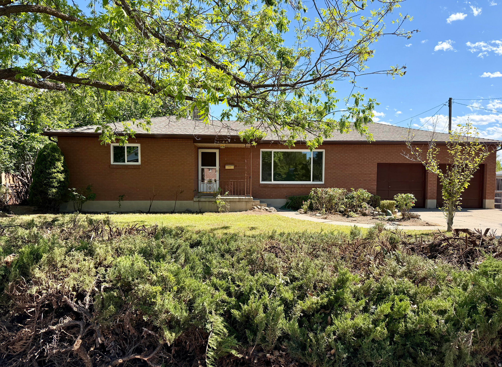 Rare all brick home in a coveted East Millcreek neighborhood backing directly to the Cottonwood Regional Park, meaning no back neighbors and added privacy. Set on a huge 0.29 acre lot with endless potential, this solid, well maintained home is ready for your vision and features a massive oversized shop, attached 2 car garage, and plenty of space to create your dream landscape both in the front and in the backyard. Offering 2,644 sq ft, 4 bedrooms, 1.5 baths, plus basement potential for 1 to 2 additional bedrooms, a third bath, a spacious family room, and abundant storage, this home is full of opportunity. Home is being Sold AS-IS.  Square footage figures are provided as a courtesy estimate only, buyer is advised to obtain an independent measurement. Seller is an agent, and agent is related to seller.