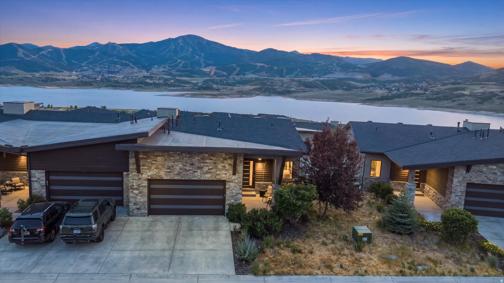 The Shoreline You've Been Waiting For Has Arrived Perfectly positioned to capture breathtaking views of the Jordanelle Reservoir, the new Deer Valley East Village and Bald Mountain, this exceptional residence offers a rare combination of sophisticated design, luxury upgrades, and year-round recreation.  Designed for both entertaining and everyday comfort, the open floorplan centers on a spacious kitchen and great room, complemented by a main-floor primary suite that offers effortless main level living and unobstructed mountain views to wake up to. The living area flows seamlessly out to a spacious deck - the perfect perch for morning coffee or sunset cocktails while soaking in the alpine scenery - while the lower patio's private hot tub invites you to unwind after a day on the slopes or trails.  Downstairs, the family room and game room with wet bar create an ideal gathering space for movie nights, gameday get-togethers, or aprs-ski celebrations with friends and family. Two guest bedrooms plus a full and second half-bathroom flank this level, along with an oversized cold storage area offering exceptional space for seasonal gear, wine storage, or outdoor equipment.  Don't miss one of the most desirable and beautifully upgraded Shoreline residences to come to market.  Furnishings negotiable with exceptions. Buyer to verify all information to their satisfaction.