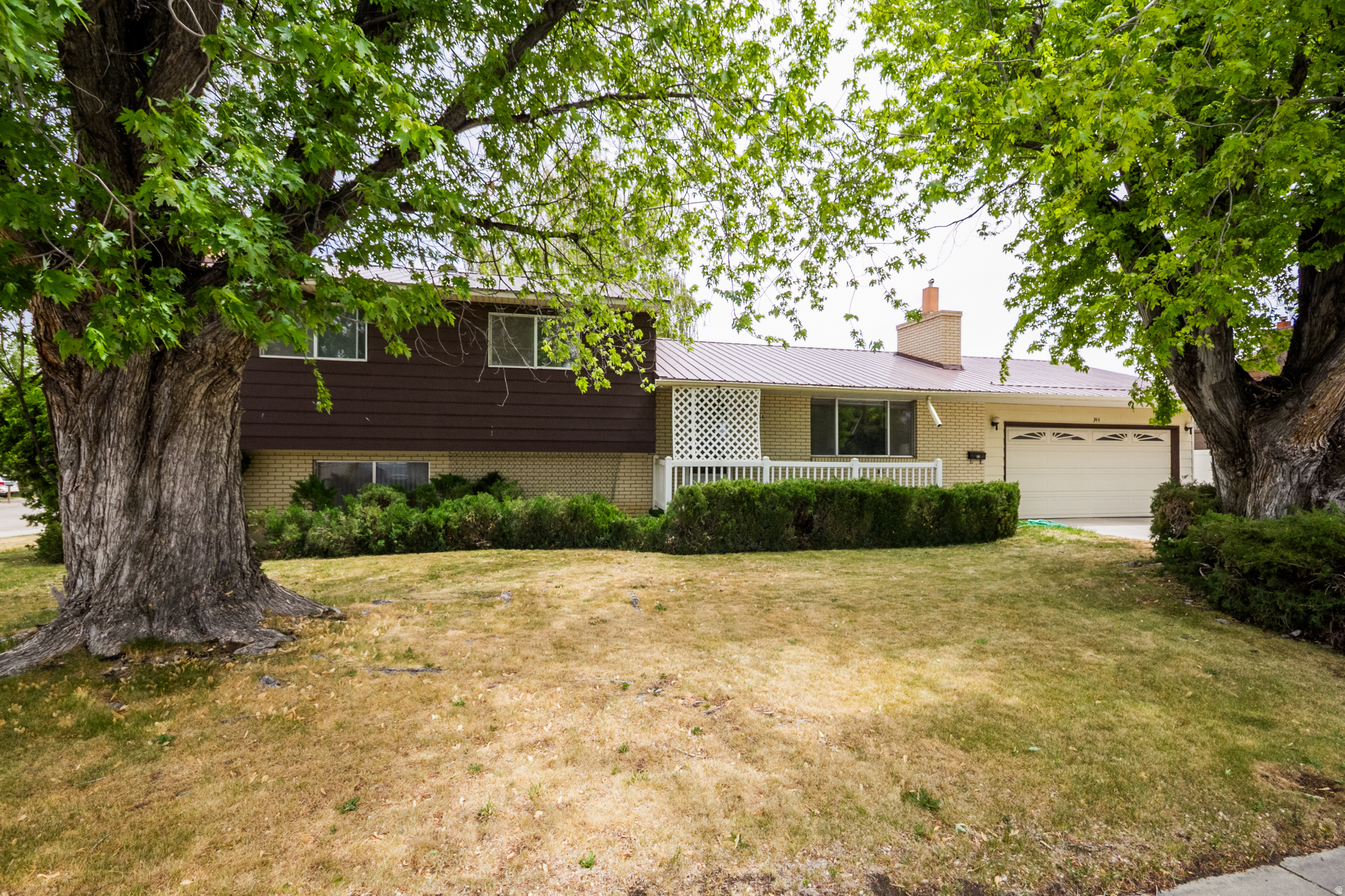 This well-built, well-maintained home showcases quality craftsmanship and character. Features like the classic wall oven and built in hall storage add charm and personality that is hard to find in today's market. It sits on a beautifully maintained and fully landscaped .24-acre lot with a convenient in-town location. You'll be sure to fall in love with the mature trees, spacious covered back patio, RV parking, and a yard that was designed for both relaxation and functionality. Inside, the home offers 3 spacious bedrooms, 1.5 bathrooms, and an abundance of storage throughout the home and garage. Recent updates including the roof, carpet, flooring, and paint that have all been completed within the last few years. The unfinished downstairs space offers excellent potential to create a private master suite, with plumbing already in place. Square footage an estimate based on county records. Buyer to verify all information including square footage.