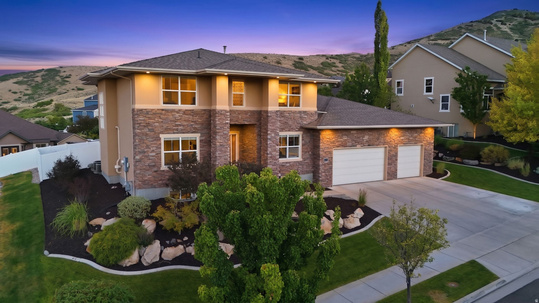 Perched in Rosecrest, this custom-built two-story home was designed for real living, not pulled from a standard builder plan. Built in 2012 with exceptional attention to quality, comfort, and efficiency, every detail reflects thoughtful craftsmanship and a floor plan curated for the way people actually live.  Enjoy breathtaking valley and mountain views, including from the primary suite, where the upper windows frame a different masterpiece each day. The open-concept kitchen flows seamlessly into a three-season porch featuring a gas fireplace and plumbing for a future kitchenette, creating the perfect space for entertaining or simply soaking in the scenery. The home's thoughtful design even allows for the three-season room to be enclosed for year-round living if desired.  Constructed with 2x6 exterior walls, blown-in R-30 insulation, insulated interior walls throughout, a fully insulated garage, dual high-efficiency furnaces, dual air conditioning systems, and a radon mitigation system already in place, the home delivers remarkable comfort with average utility costs of approximately $140 per month.  The spacious primary suite offers a spa-like bath with a jetted tub and oversized 7-foot shower. Solid-core ADA-compliant doors, oversized stairwells, and generous living spaces further showcase the home's custom design. Additional thoughtful features include a convenient drop zone off the garage, dedicated holiday lighting outlets under the overhangs, and a basement great room with kitchenette.  The oversized garage features 13-foot ceilings, extra width with 3-foot returns, and enough height to accommodate a vehicle lift while still offering incredible storage capacity.  Combining custom construction, impressive efficiency, future flexibility, and spectacular views, this is a rare opportunity to own a home built to a higher standard.