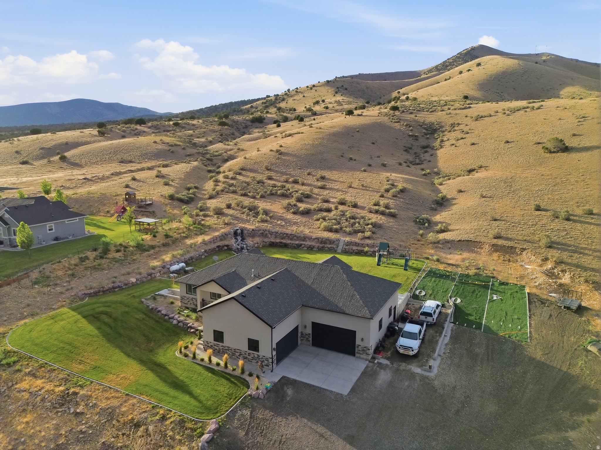 Welcome to South Rim mountain living where wide open skies meet turn-key comfort. Perched on 3 acres of horse property, this home offers privacy, peace, and room to grow, all with no HOA. Built in 2017 and better than new, thanks to thoughtful upgrades including brand new carpet just installed & new water heater. Inside, enjoy a bright open floor plan with granite countertops, three bedrooms, two baths, and a walkout basement ready for your vision. Step outside to a fully finished front and back yard with drip irrigation, a covered patio perfect for quiet mornings or sunset evenings, and a serene waterfall feature. For toys, tools, or trailers, you'll love the 6-car garage and dedicated RV parking. 45 minutes from Salt Lake City, this is where starry nights, glowing sunrises, and true mountain tranquility become part of your everyday life. Square footage figures are provided as a courtesy estimate only and were obtained from building plans. Buyer is advised to obtain an independent measurement.
