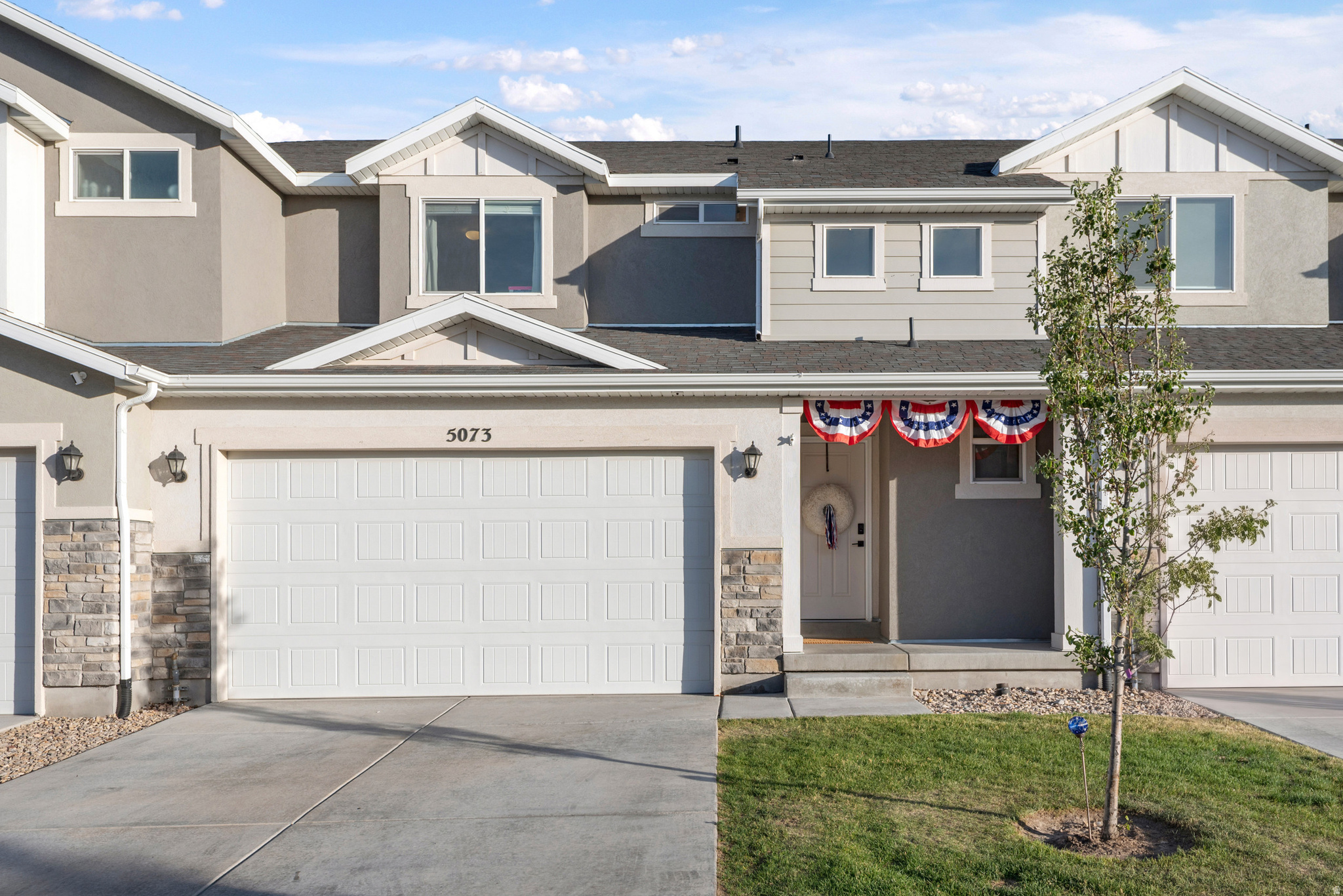 At 2,237 sq ft, this is one of the largest townhomes in Herriman Towne Center, and the finish work sets it apart. The countertops, cabinets, paint, and wallpaper give the main level a higher-end feel than you'll find in most townhomes in the area. The open kitchen, dining, and living space flow together on the main floor, while upstairs offers three bedrooms, including a primary suite with a walk-in closet and private bath. The basement is fully finished aside from baseboards and a couple of doors, with the exception of one bathroom area that's already plumbed and ready to complete. Best of all, every appliance stays, including the washer and dryer, making move-in day that much easier. And don't overlook the convenience of the attached two-car garage. Location is hard to beat: Walking distance to the splash pad, dog park and J Lynn Crane Park, a quarter mile to JL Sorenson Rec Center, Silver Crest Elementary, the library, and city hall, two minutes to Mountain View Corridor, and close to Costco, Smith's, and Harmons, with trails, the Herriman Bike Park, and Blackridge Reservoir all nearby. Schedule your private showing today!  Square footage figures are provided as a courtesy estimate only and were obtained from County.  Buyer is advised to obtain an independent measurement.