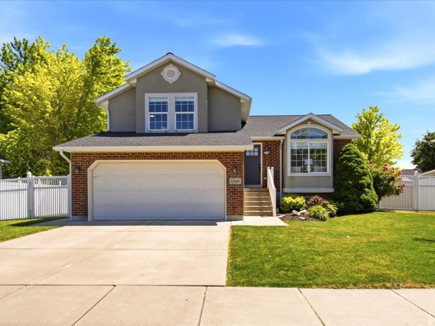 In a city known for its strong sense of community and easy access to everything Northern Utah has to offer, this home is located in the peaceful tree-lined street subdivision of Kayscreek Estates. A consistent record of updates over the years from the homeowners offers comfort, connection, and ease. Vaulted ceilings make a first impression from the moment you enter. Throughout the home, tasteful updated flooring and paint create a fresh, timeless feel. The remodeled kitchen serves as the heart of the home and overlooks the private south facing backyard. Upstairs the primary suite offers a peaceful retreat, complete with a walk-in closet and fully remodeled bathroom featuring double sinks, quartz countertops, and classic pearl chevron tile, creating a refined spa-like escape. Two additional bedrooms are located on the second level with spacious closets, sharing a well-appointed full bathroom. Stepping out through the walk-out patio, the backyard features a pergola and playground-perfect for weekend gatherings, quiet mornings, or simply enjoying time outdoors. The surrounding community enhances the lifestyle further with nearby walking paths, community parks, green spaces, and direct access to the ten-mile West Davis Trail.
