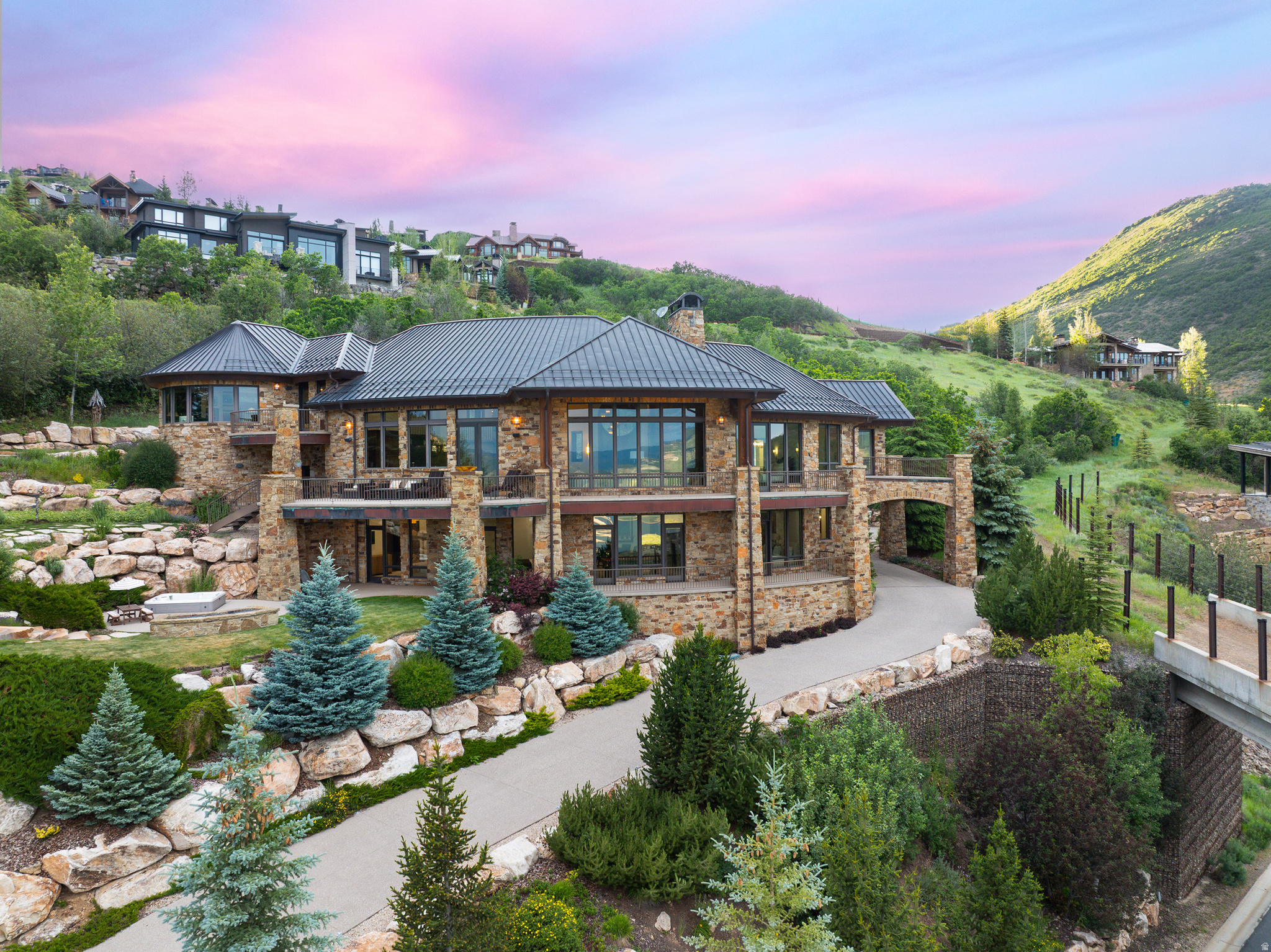 Experience the pinnacle of mountain living in this luxury custom ski-in/ski-out estate within the exclusive Deer Crest community of Deer Valley, where breathtaking views of the Jordanelle Reservoir and world-class craftsmanship come together. Expertly built by renowned custom builder Thomas McFee, this exceptional residence showcases timeless design, impeccable quality, and a thoughtfully curated floor plan designed for both grand entertaining and everyday comfort. The main level features an expansive open concept great room and chef's kitchen with top-of-the-line appliances, a spacious pantry, and a built-in pizza oven, along with a luxurious primary suite and an additional ensuite bedroom. Upstairs, a private office with spectacular views can also serve as a sixth bedroom. The walkout lower level offers a second family room with wet bar, three additional ensuite bedrooms, a dedicated ski prep room, theater, and wine storage space. An oversized heated two-car garage is designed to accommodate large SUVs while providing amble drive way parking for all your guests. Offering six ensuite bedrooms, eight bathrooms, and true ski-in/ski-out access, this extraordinary residence delivers an unparalleled Deer Valley lifestyle. Ideally located just minutes from the base of Deer Valley Resort, the Jordanelle Reservoir, and Historic Main Street Park City, the home also offers convenient access to the Heber Valley private airport and is approximately 40 minutes from Salt Lake City International Airport. Contact us today to schedule a private showing of this remarkable luxury mountain retreat.