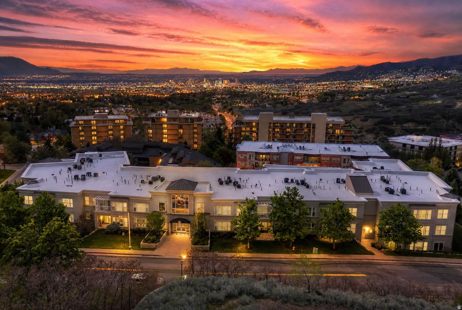 Located in one of Salt Lake City's favorite east bench neighborhoods at the mouth of Emigration Canyon, this residence at The Presidential Club offers an exceptional combination of lifestyle and convenience. Just minutes to the University of Utah and downtown Salt Lake City, the location provides easy access to nearby dining, culture, and outdoor recreation. This well-designed one-bedroom floor plan offers excellent functionality for modern living, enhanced by a flexible sunroom that can serve as a home office, guest space, or quiet retreat. The interior is light and bright, with views overlooking the beautifully landscaped courtyard. The condo features a roomy primary suite including a full bath with separate tub and shower and walk-in closet. Additionally, there is a half bath for guests, and a full laundry room with washer and dryer. Also included are two secure garage parking spaces and a dedicated storage unit within the garage. Residents enjoy a secure building and access to a range of amenities including a lobby area with panoramic valley views, a community theatre room, entertaining space, and a fully equipped gym. The courtyard is perfect for relaxing and enjoying the gardens. Neighborhood parks, Red Butte Garden and nearby hiking and biking trails add appeal to this exceptional location. A rare opportunity to own in a premier community that offers both comfort and connection to the best of Salt Lake City. Photos include virtual staging.