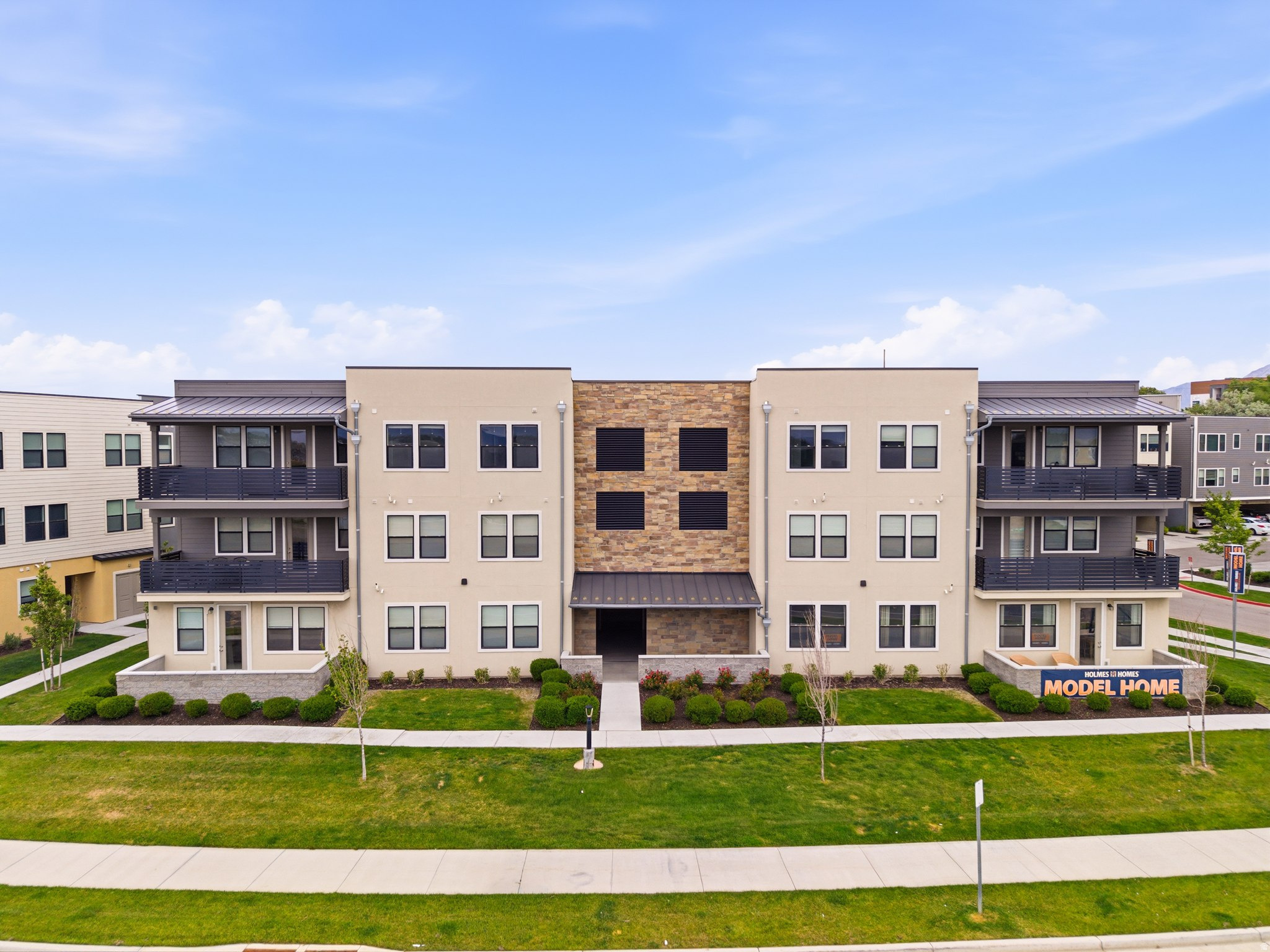 *Ask about Preferred Lender Credit of $5,000!* Welcome Home to modern living in the heart of Midvale! This beautifully designed 3-bedroom, 2-bath condo offers 1,426sqft of open and functional living space with a bright contemporary feel throughout. The spacious kitchen features quartz countertops, white shaker cabinetry, stainless steel appliances, oversized island seating, and abundant storage, all opening seamlessly into the main living and dining areas.  The primary suite offers a private bathroom and large closet space, while the additional bedrooms provide flexibility for guests, family, or a home office. One of the standout features of this unit is the massive covered deck, creating an incredible extension of the living space and the perfect spot to relax or entertain year-round.  Located in a newer community with modern architecture, outdoor gathering spaces, fire pit areas, playgrounds, and walking paths. Includes a tandem 2-car garage plus easy access to shopping, dining, entertainment, and commuter routes. HOA is just $200/month.  Conveniently located near Bingham Junction TRAX station, Jordan River Parkway trails, Topgolf, and quick freeway access for an easy commute anywhere in the valley. This is low-maintenance living with style, space, and location all in one package. *SELLER FINANCING AVAILABLE*