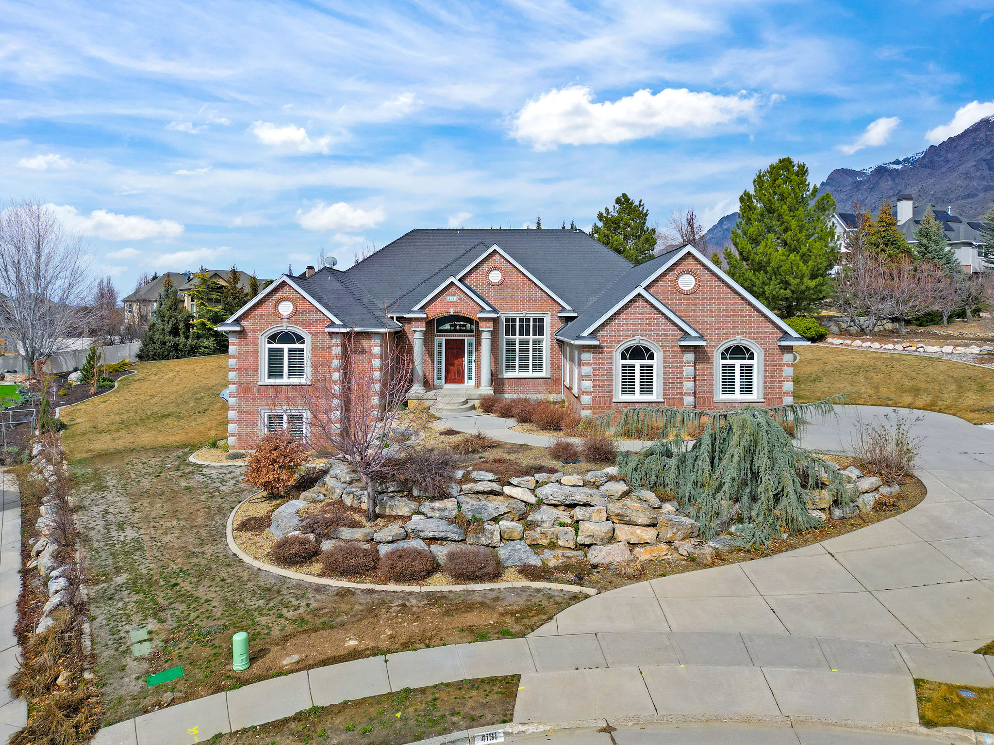 SHORT SALE- Need to sell by June, make an offer! Welcome to your sanctuary in beautiful Pleasant View, where every angle reveals a breathtaking perspective-from sweeping valley panoramas in the front to the iconic Ben Lomond peak framing the back. This exceptional residence seamlessly blends timeless elegance with modern comfort, offering refined living at its finest. Step through the grand entryway into an immaculate main level designed for both effortless entertaining and intimate gatherings. The formal dining room, dual family rooms, and an inviting open-concept kitchen create a harmonious flow throughout the home. The kitchen features custom cabinetry, premium finishes, and an airy layout that inspires both culinary creativity and connection. The main level also hosts a serene master suite and a beautifully appointed mini suite-each offering privacy, sophistication, and comfort. The lower level has been fully reimagined as a contemporary luxury apartment, featuring three spacious bedrooms, an elegant family room, a formal dining area, and a designer kitchen crafted with exceptional attention to detail. Impeccably maintained and thoughtfully updated, this home captures the essence of elevated mountain living. Discover the unparalleled beauty and serenity that define Pleasant View-schedule your private showing today. Square footage figures are provided as a courtesy estimate only. Buyer is advised to obtain an independent measurement.