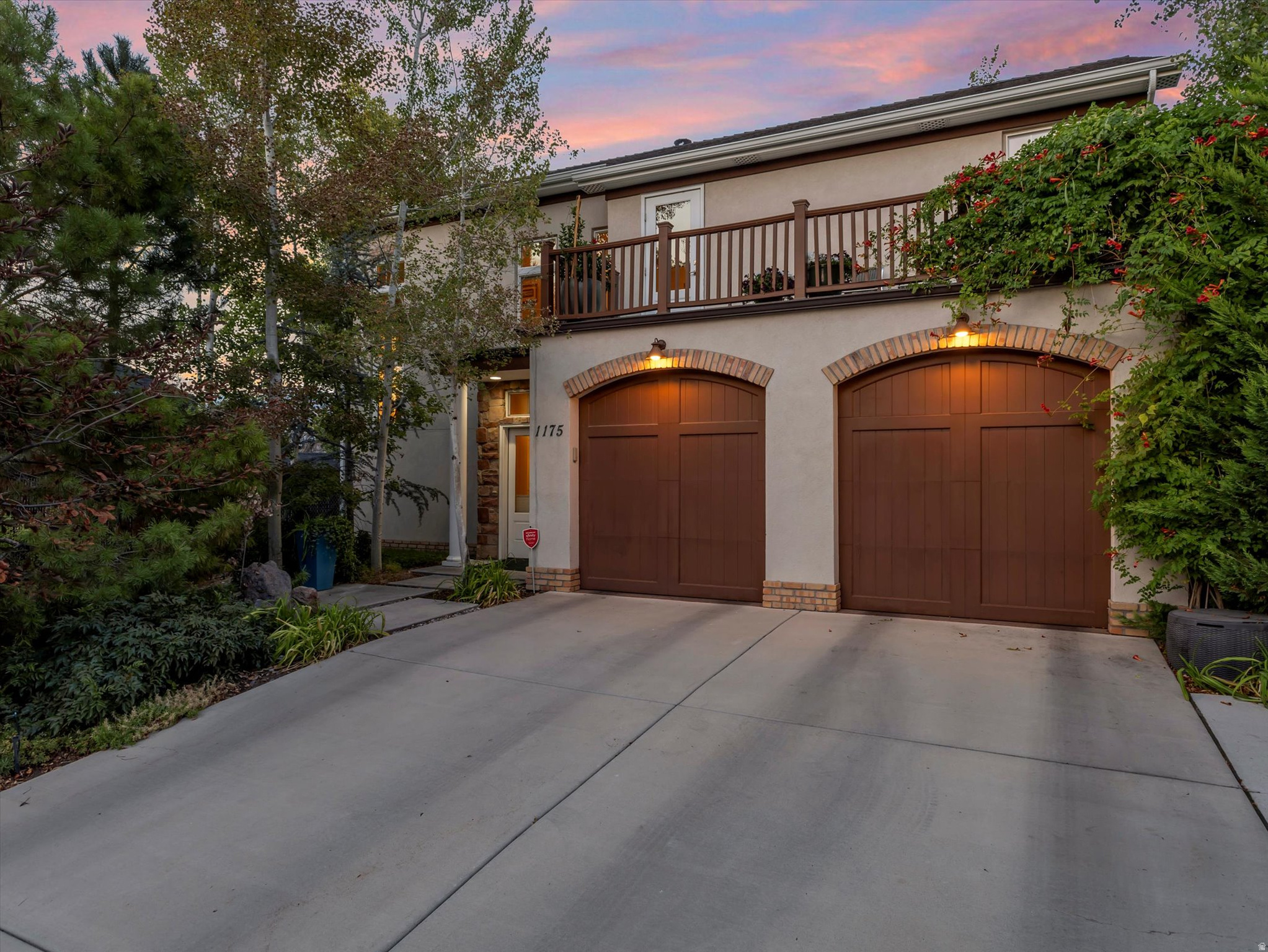 Stunning home in the beloved Liberty Wells Place Neighborhood. Perfectly positioned in a quiet cul-de-sac, this exceptional home offers a park-like setting in one of Salt Lake's most desirable locations. Enjoy the convenience of being just steps from Liberty Park, local shops and restaurants plus it is just minutes from Sugar House, Downtown, and the University of Utah. Built in 2017, this home beautifully combines timeless craftsmanship and character with the quality, efficiency, and comfort of modern construction. Thoughtfully designed and meticulously finished, it showcases high-end details throughout, including elegant light fixtures, three-tone paint, tall baseboards, LVP flooring, french doors, transom windows, tray ceilings, recessed lighting, custom cabinetry, and ceiling fans. Step inside to a warm and welcoming entryway highlighted by a grand staircase with built-in bookshelves and a striking chandelier. The open-concept great room is filled with natural light and features vaulted ceilings, large picture windows, and a cozy gas fireplace with a sleek tile hearth - the perfect backdrop for everyday living and entertaining. At the heart of the home, the gourmet kitchen boasts quartz countertops, designer tile backsplash, custom cabinetry, a butler's pantry with beverage cooler, stainless steel appliances, and a gas range with vent hood. A large center island with pendant lighting and seating provides the ideal gathering space for family and friends. The luxurious primary suite offers a peaceful retreat, complete with a tray ceiling, custom walk-in closet, and spa-inspired ensuite bathroom featuring quartz countertops, a custom vanity,  a soaking tub, and a separate shower. Enjoy three inviting outdoor living spaces designed for year-round enjoyment: a balcony overlooking the community, a private covered patio off the primary suite, and an expansive deck off the great room with an adjustable awning for sun or shade and a natural gas connection. Each setting provides the perfect spot for relaxing, dining, or entertaining in the fresh air. Additional highlights include abundant storage throughout, including a spacious under-stair closet, and an attached two-car garage with ample room for vehicles and gear. For truly effortless living, the HOA handles snow removal and landscape maintenance, allowing you to relax and enjoy your beautiful home and the charming Liberty Wells Place community.