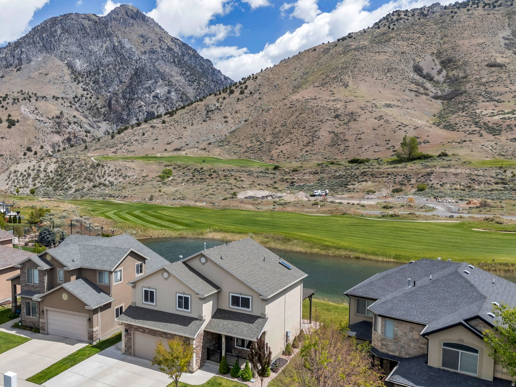 Nestled in the highly sought-after Cedars community in Cedar Hills, this fully renovated home sits directly on the Cedar Hills Golf Course with breathtaking views of the mountains, tranquil water features, and American Fork Canyon. With no backyard neighbors, enjoy a peaceful, private setting where wildlife and nature become part of your everyday experience. Featuring 6 bedrooms, 4 bathrooms, and 2,924 sq ft, this home has been thoughtfully upgraded from top to bottom. On the second level, you'll find four bedrooms and a den/family room, two of which are east-facing and capture incredible views of the golf course, mountains, water, and canyon, unreal. Highlights include a brand new kitchen with new appliances, new roof, new windows, upgraded HVAC and A/C systems, and a water softener. The spacious basement offers two large bedrooms, a full bath, and a generous family and recreation space, perfect for gathering or relaxing. Step outside to your own private retreat with a covered deck, patio, and pergola, all perfectly positioned to capture the unobstructed views. Located just minutes from everyday amenities, yet tucked away in a quiet, serene neighborhood, this home offers the perfect balance of convenience and tranquility. This home is a total vibe, come experience it for yourself.