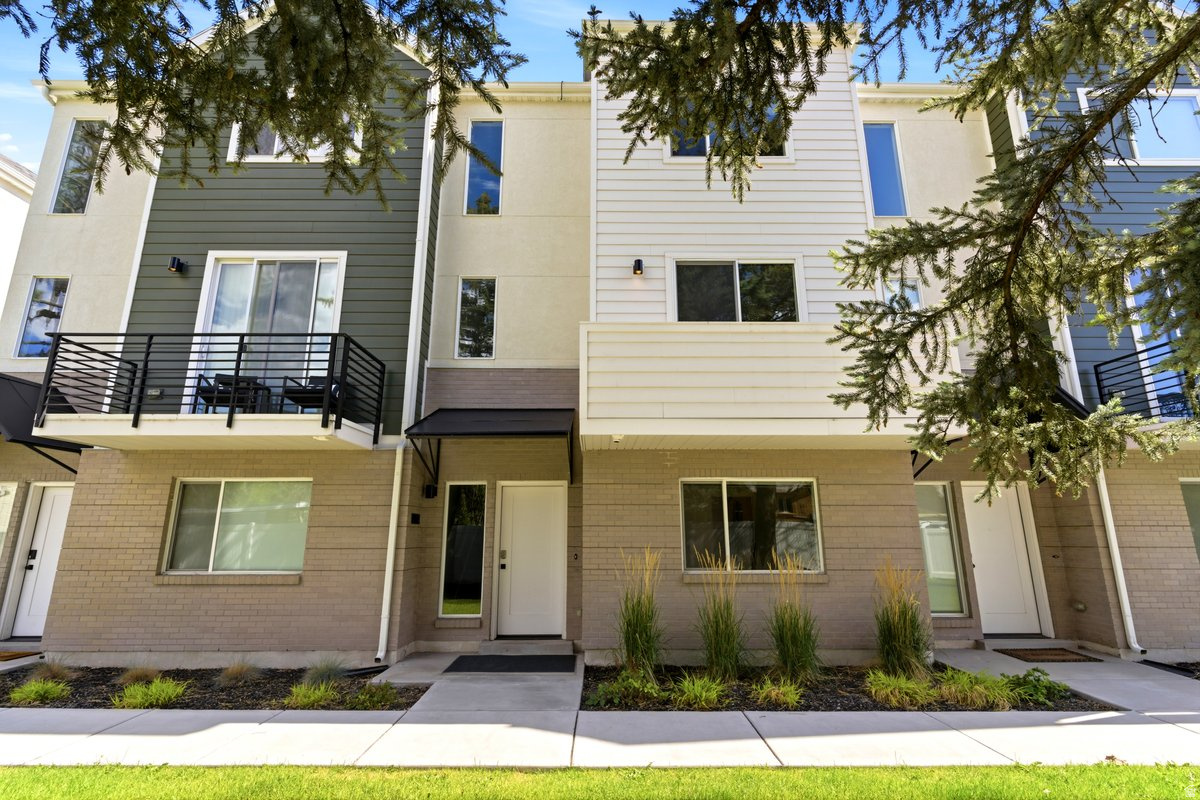 This beautifully refreshed townhome offers a flexible floor plan with 3 private bedrooms, including 2 spacious en-suite bedrooms upstairs and a 3rd bedroom on the main level with a full bathroom conveniently located adjacent. Freshly updated with brand-new carpet and paint throughout, the home is move-in ready and waiting for its next owner.  Enjoy relaxing on the private balcony while taking in mountain views, or take advantage of the unbeatable location with quick access to the freeway, shopping, dining and everyday conveniences.  Whether you're looking for a primary residence, second home, or investment opportunity, you'll appreciate that short-term rentals are permitted, providing excellent flexibility and income potential.   Square footage figures are provided as a courtesy estimate only and were obtained from _digital measurements_____________ .  Buyer is advised to obtain an independent measurement.