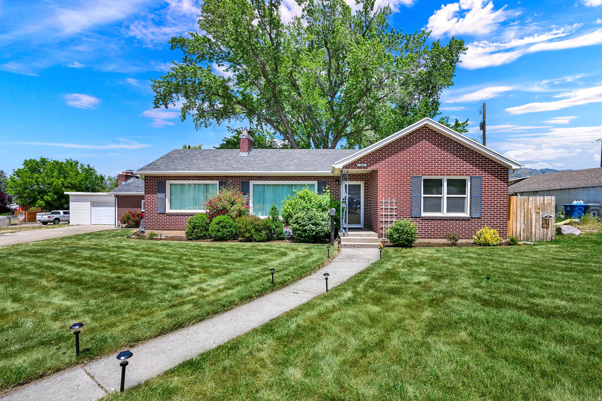 Located in the heart of South Ogden, this charming 6 bedroom, 2 bath home offers the perfect blend of character, comfort, and convenience. Just minutes from shopping, restaurants, freeway access, and the new South Ogden Trader Joe's, this location makes commuting and everyday living incredibly easy while still giving you a peaceful neighborhood feel. Inside, you'll love the timeless charm and warmth this home offers, with inviting living spaces, a functional layout, and room for everyone. With large bedrooms, plenty of storage space, beautiful hard wood floors and an updated kitchen, this home is the perfect mix of special charming touches and modern convenience. Whether you need extra bedrooms for family, guests, a home office, or hobby space, this home provides flexibility and value that's hard to find in South Ogden real estate. Brand new carpet, paint, and newer systems  make this space ready to move in with no effort.  Step outside and you'll find one of the true highlights of the property; an incredible backyard built for relaxing and entertaining. The spacious covered patio creates the perfect setting for summer BBQs, outdoor dining, game nights, or simply enjoying Utah evenings in your own private retreat. There is a hookup for a hot tub on the patio. The corner lot provides privacy and the large lot creates a sense of peace. With mature landscaping and plenty of room to gather, this backyard is designed for making memories. With a detached, spacious 2 car garage and a circular drive for ease, there's plenty of parking for car collectors, entertaining, and everything in between.  If you're searching for a home for sale in South Ogden, Utah with space, charm, a great backyard, and easy access to shopping, dining, and I 15, 266 Chimes View Drive is one you won't want to miss. Square footage figures are provided as a courtesy estimate only and were obtained from county records. Buyer is advised to obtain an independent measurement. Construction on road will be done October 2026 - all new sidewalks and an updated storm drain system are being added. You can still drive down the street and park in the driveway for showings.