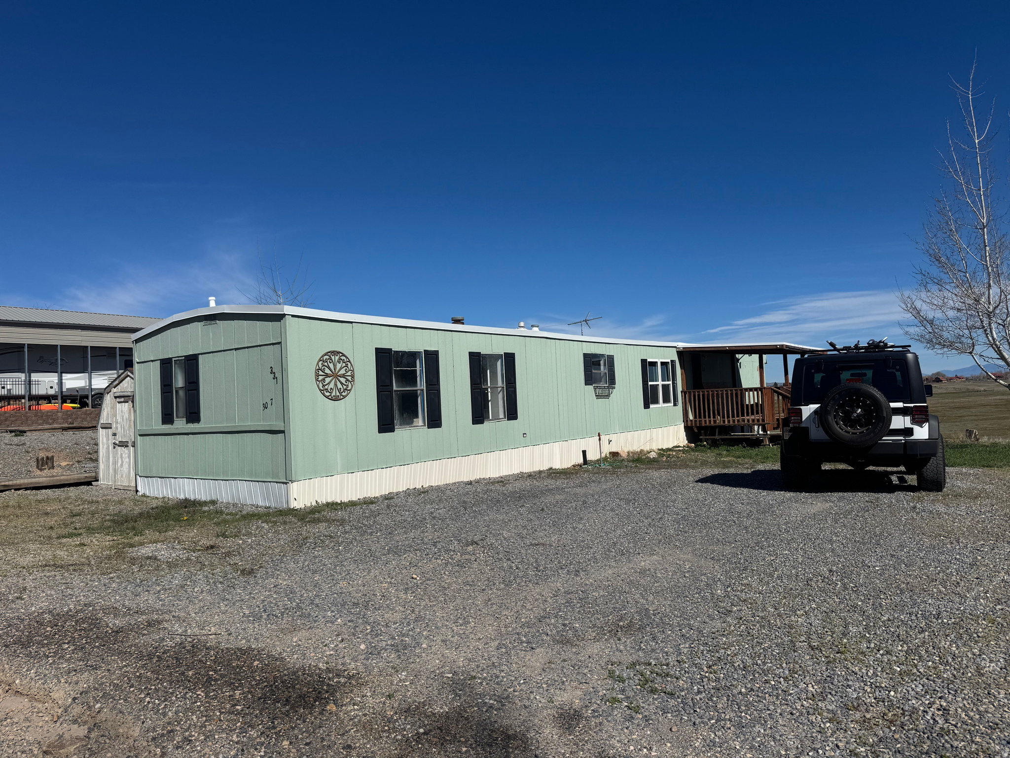 Three bedroom, two bath mobile home located in Sweetwater RV Park. Partially remodeled with new sub floors and LVP, new shower/tub combos, newly painted, new roof (60 mil TPO w/sheeting and insulation; 20 year warranty). Selling as-is. COVETED FRONT ROW with unobstructed view of the meadow and Bear Lake. Covered front porch and storage shed. Amenities include pool, two playground areas, large grassy common area for activities and picnicking, sand VB pit, basketball court and overflow parking. Access ATV/UTV path that goes to nearby public beach from upper Sweetwater RV area. Pickleville Playhouse close by as well as Hodges Canyon Trailhead for access into Cache National Forest and The Siinks for ATV/UTV, snowmobiling and hiking,