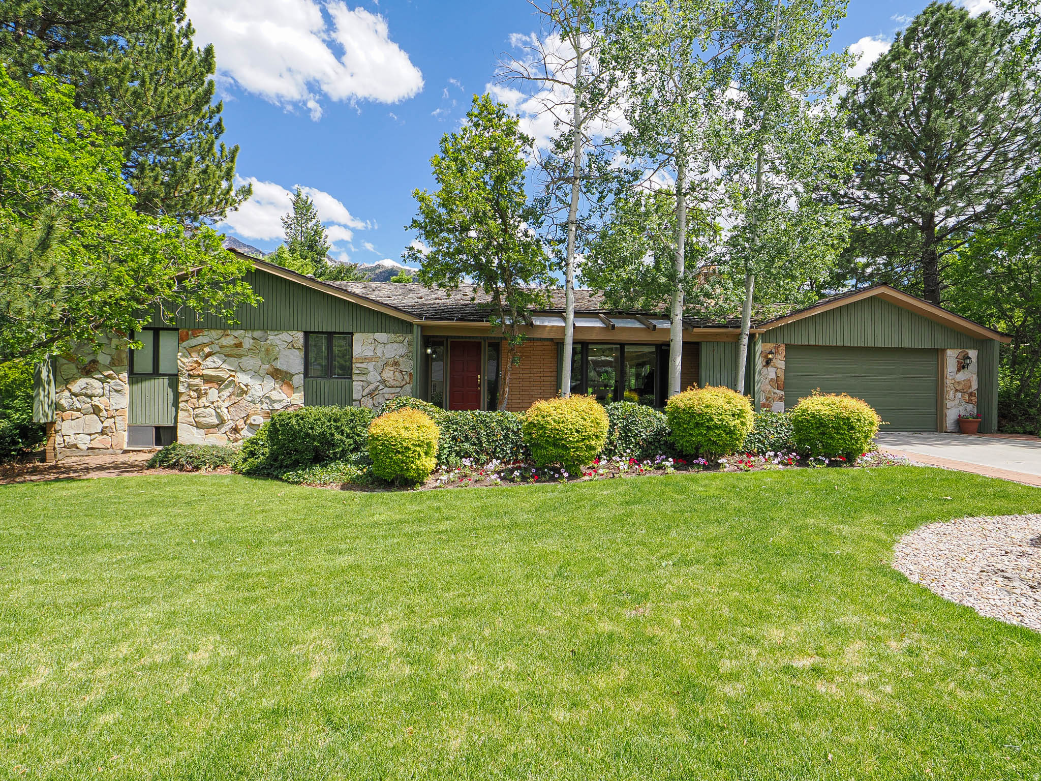 This is a special home! It is on the 16th tee of the Willow Creek Country Club Golf Course. It has been in the Condie family since it was built in 1972. After the kids were gone, it was remodeled for main-floor living and convenience. Rita lovingly named it the "Empty Nester", with one bedroom of closets, cabinets, drawers, and laundry, and a second bedroom that became an office and library. The home is spectacular for entertaining. You walk into the front foyer, step into the fabulous living room with a beautiful stone gas fireplace. Then you wrap around to the formal dining room, then into the kitchen with bar seating, and finally the comfy family room. The 1/3-acre yard is incredible front to back, with landscaping that is unsurpassed in Salt Lake County, providing seclusion and tranquility. The back yard deck can be accessed from the main-floor master bedroom or family room, and it slopes down to two large patios, one of stone and one of brick. Aside from a basement master bedroom suite, the unfinished basement offers over 1,500 sq ft for multiple bedrooms, a bath or two, and a huge family room with a fireplace.  20 amp EV charging in the garage takes overnight to charge mid size car. Square footage figures are provided as a courtesy estimate only and were obtained from Appraisal. Buyer is advised to obtain an independent measurement.