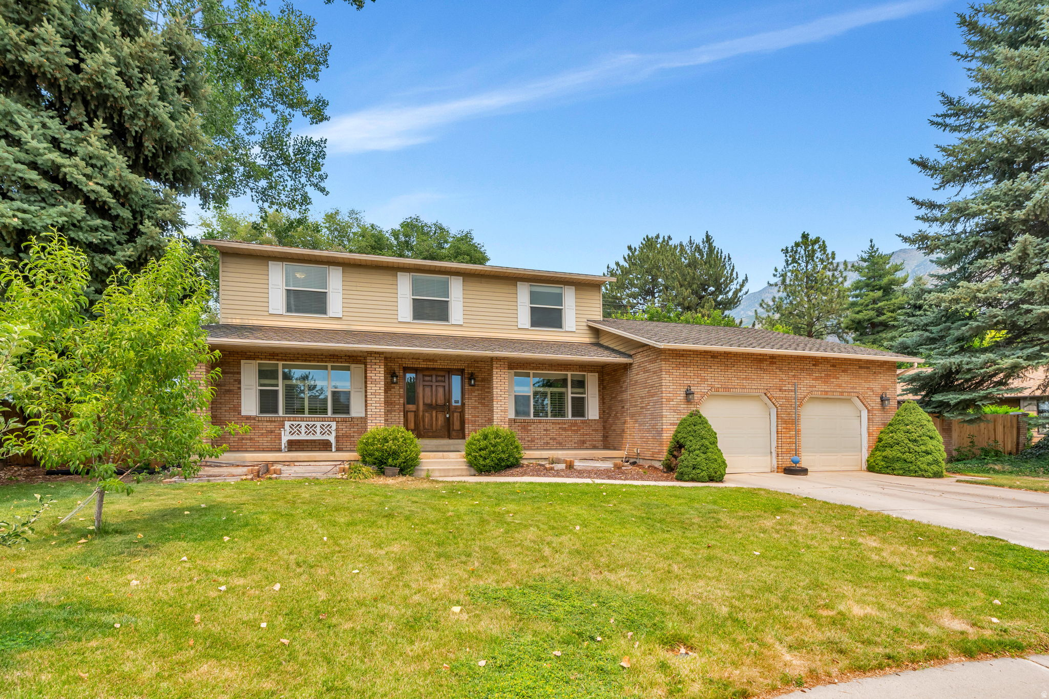 Spacious family home on a quiet cul-de-sac in Provo's sought-after northeast side, minutes from Timpview High, Rock Canyon trailhead, and the mouth of Provo Canyon. Set on a quarter-acre lot with mature trees, newer fencing, mountain views, and no HOA. The main floor features a remodeled kitchen with granite countertops, stainless steel appliances, and a built-in bench-seat nook, plus a spacious family room, formal living and dining areas, half bath, and laundry. Plantation shutters and hardwood floors throughout the main level. Upstairs: four bedrooms including the primary suite with a recently remodeled bathroom, plus a full second bath. The finished basement adds two more bedrooms, one rec rooms, a 3/4 bathroom, a wood stove, and ample storage including unfinished cold storage. Separate basement entry. The basement layout is flexible and could be reconfigured for additional bedrooms if needed. Two-car attached garage. Forced-air heating and central A/C with newer mechanical equipment. Double-pane windows. Covered front porch and covered rear patio. Appraised at $735,000 (May 2026).   Square footage figures are provided as a courtesy estimate only and were obtained from appraisal .  Buyer is advised to obtain an independent measurement.