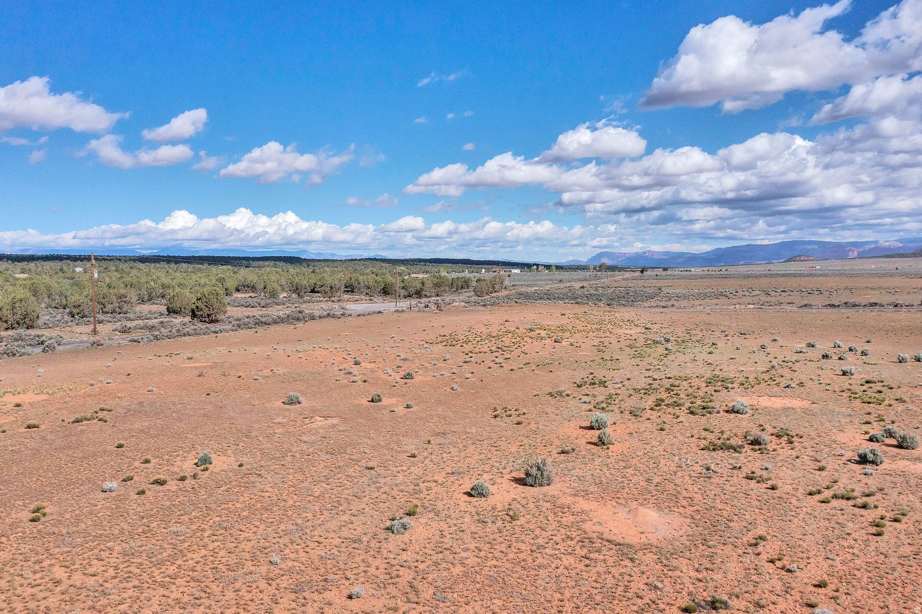 With breathtaking views of Smithsonian Butte, Canaan Mountain, and Zion National Park, this exceptional 5-acre corner lot offers a rare opportunity to create something truly special.Whether you envision a private mini ranch or a custom dream home, the setting delivers unmatched beauty and tranquility. With greenbelt status and one acre-foot of water included, this property combines lifestyle, flexibility, and long-term value in one remarkable offering.