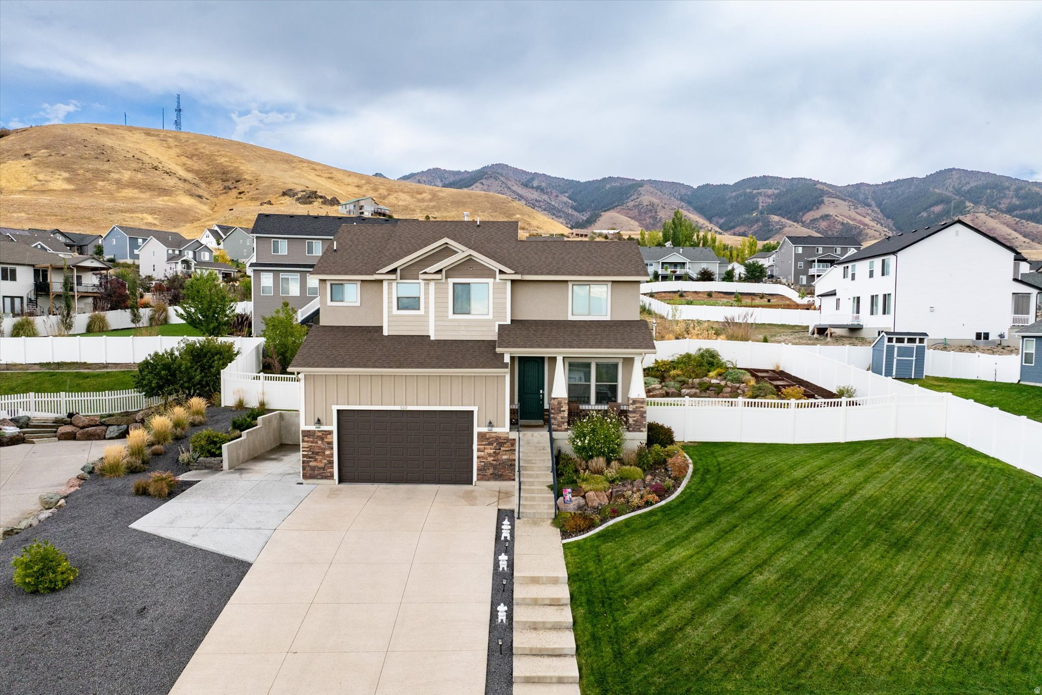 Spacious and bright open-concept 2-story home with 6 bedrooms, 3.5 baths, and 3,169 sq. ft. on a .28-acre lot. Built in 2015, this home offers a fully finished basement, attached 2-car garage with extra vertical storage, RV parking and brand-new carpet throughout! The beautifully landscaped yard features automated sprinklers, a fenced backyard, and fruit trees, including peach, pear, and apple trees. Enjoy stunning mountain and valley views, along with gorgeous sunsets from the front porch. Easy to show. Call agent for details.