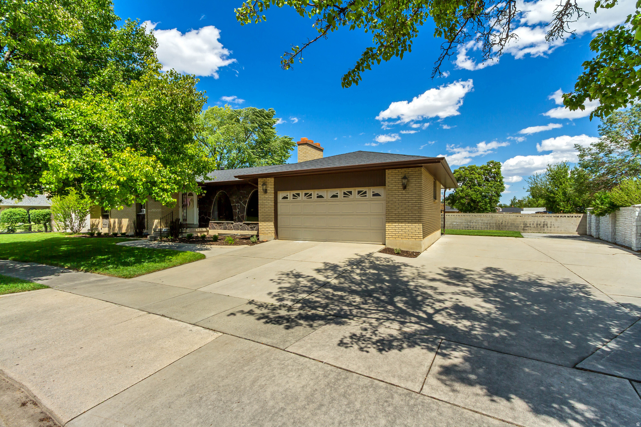 Welcome home to one of the best locations in the neighborhood! Tucked away on the very last street, this home offers peace, privacy, and minimal traffic in an established community lined with mature trees. Situated on a spacious .29-acre corner lot, there's plenty of room to enjoy the outdoors, entertain, play, or park your trailer, boat, or toys with the oversized side driveway.  Inside, the home is filled with natural light thanks to large windows throughout and features thoughtful updates that make it both stylish and functional. The fully updated kitchen includes granite countertops, updated flooring, a pantry, and a gas range perfect for cooking and gathering. The inviting layout offers great flow for everyday living with multiple gathering spaces and two cozy fireplaces.  The spacious primary suite is conveniently located on the main level and easily accommodates a king-size bed, creating a comfortable private retreat. The updated primary shower adds a fresh, modern feel to the space. Upstairs, you'll find two additional bedrooms, while the downstairs offers a guest room and dedicated office space, giving flexibility for visitors, working from home, hobbies, or a growing household.  With updated features, beautiful natural light, established trees, and space to grow both inside and out, this home combines comfort, functionality, and charm in a truly hard-to-beat location.   And say goodbye to long commutes and enjoy the perfect balance of convenience and comfort. Located just 6 minutes from the freeway, less than 20 minutes from downtown Salt Lake City, and only 15 minutes from the airport, this home makes getting anywhere in the valley quick and easy while still offering the peace and quiet of an established neighborhood.  Roof about 3.5 years old.